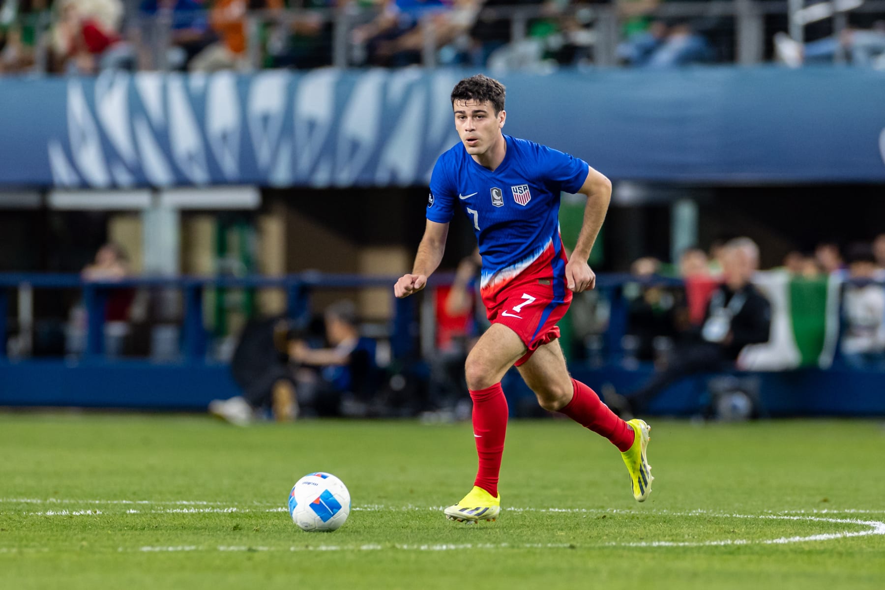 ARLINGTON, TX - MARCH 21: United States forward Gio Reyna (#7) dribbles up field during the Concacaf Nations League semi final match between the United States and Jamaica on March 21, 2024 at AT&T Stadium in Arlington, Texas. (Photo by Matthew Visinsky/Icon Sportswire via Getty Images)