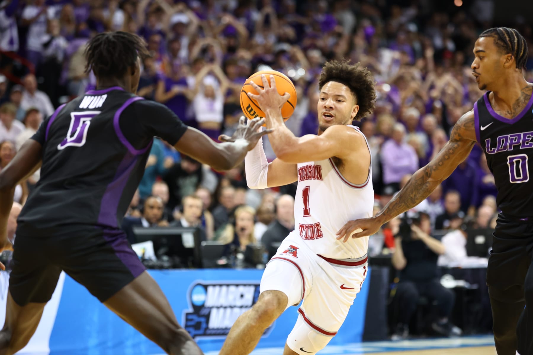 SPOKANE, WASHINGTON - MARCH 24: Mark Sears #1 of the Alabama Crimson Tide drives the lane against Lok Wur #5 of the Grand Canyon Antelopes during the second round of the 2024 NCAA Men's Basketball Tournament held at Spokane Veterans Memorial Arena on March 24, 2024 in Spokane, Washington. (Photo by C. Morgan Engel/NCAA Photos via Getty Images)