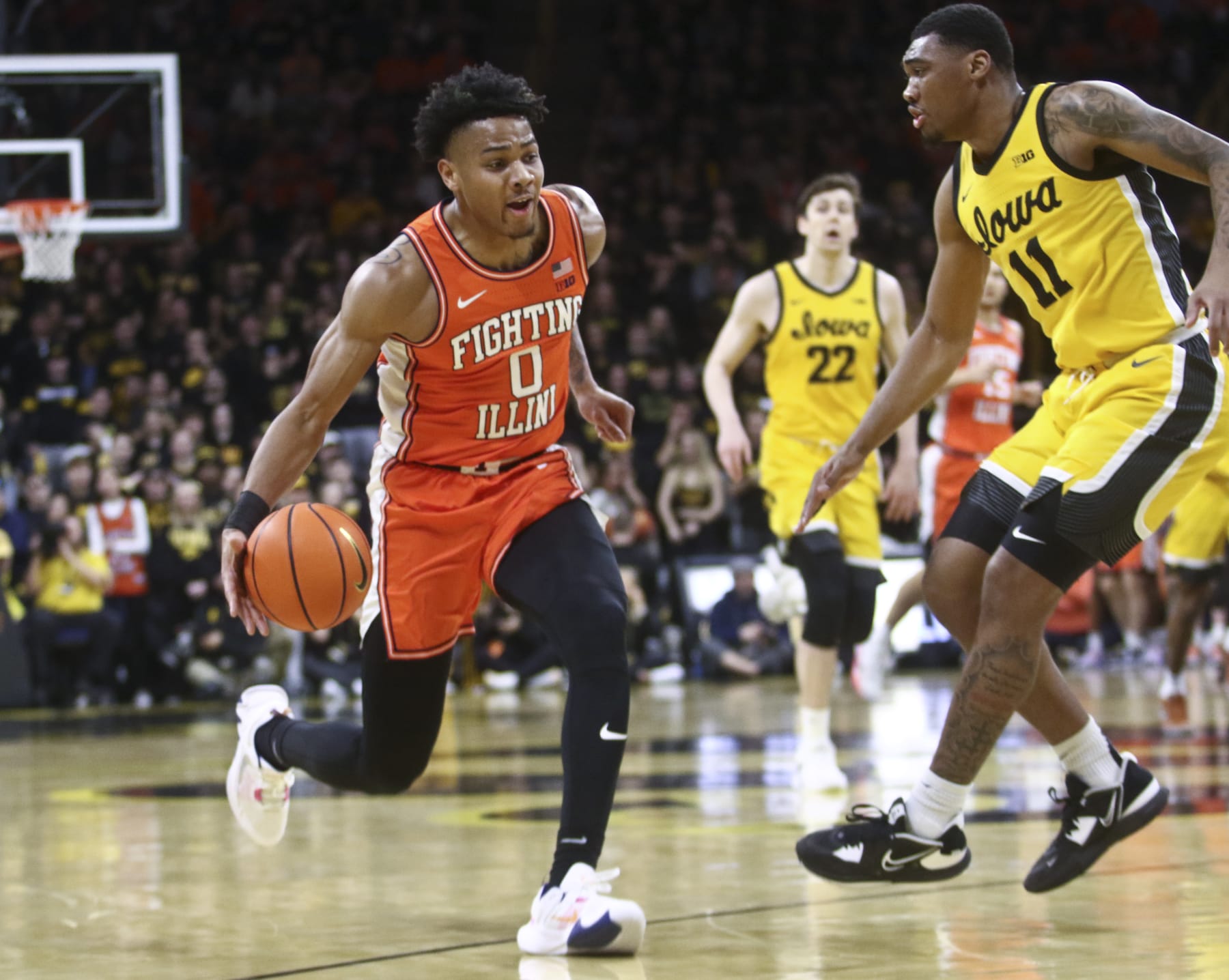 IOWA CITY, IOWA - FEBRUARY 04: Guard Terrence Shannon #0 of the Illinois Fighting Illini drives to the basket during the first half against guard Tony Perkins #11 of the Iowa Hawkeyes at Carver-Hawkeye Arena, on February 4, 2023 in Iowa City, Iowa. (Photo by Matthew Holst/Getty Images)