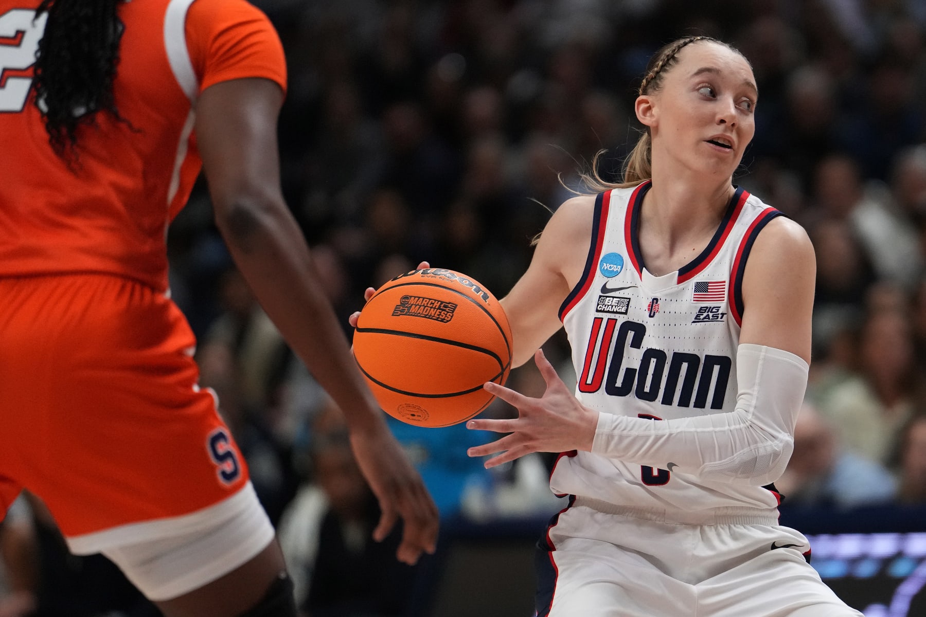 STORRS, CONNECTICUT - MARCH 25: Paige Bueckers #5 of the Connecticut Huskies looks for the open pass against the Syracuse Orange during the second half of a second round NCAA Women's Basketball Tournament game at the Harry A. Gampel Pavilion on March 25, 2024 in Storrs, Connecticut. (Photo by Joe Buglewicz/Getty Images)