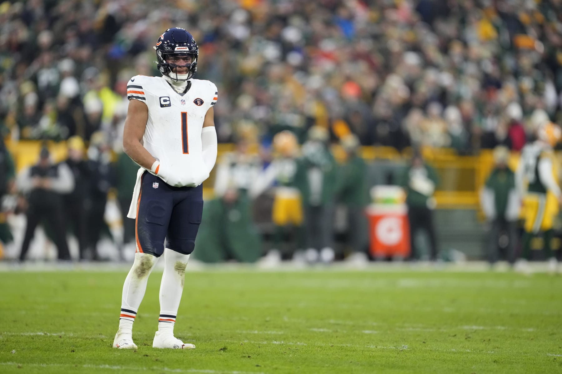 GREEN BAY, WISCONSIN - JANUARY 07: Justin Fields #1 of the Chicago Bears looks on in the first half against the Green Bay Packers at Lambeau Field on January 07, 2024 in Green Bay, Wisconsin. (Photo by Patrick McDermott/Getty Images)