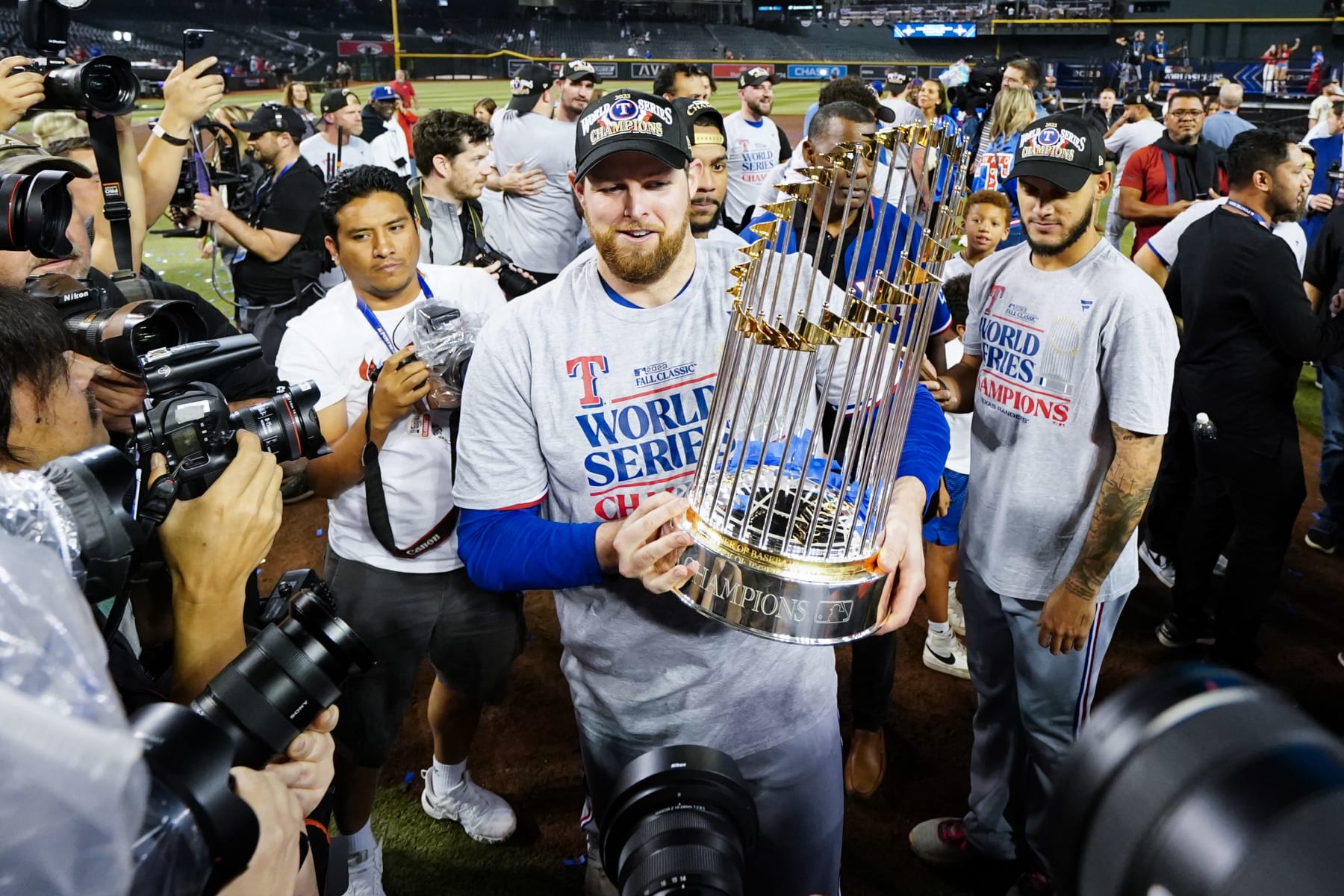 PHOENIX, AZ - NOVEMBER 01: Jordan Montgomery #52 of the Texas Rangers holds the Commissioner's Trophy after winning Game 5 of the 2023 World Series between the Texas Rangers and the Arizona Diamondbacks at Chase Field on Wednesday, November 1, 2023 in Phoenix, Arizona. The Rangers defeated the Diamondbacks 5-0 to win the World Series. (Photo by Rob Tringali/MLB Photos via Getty Images)