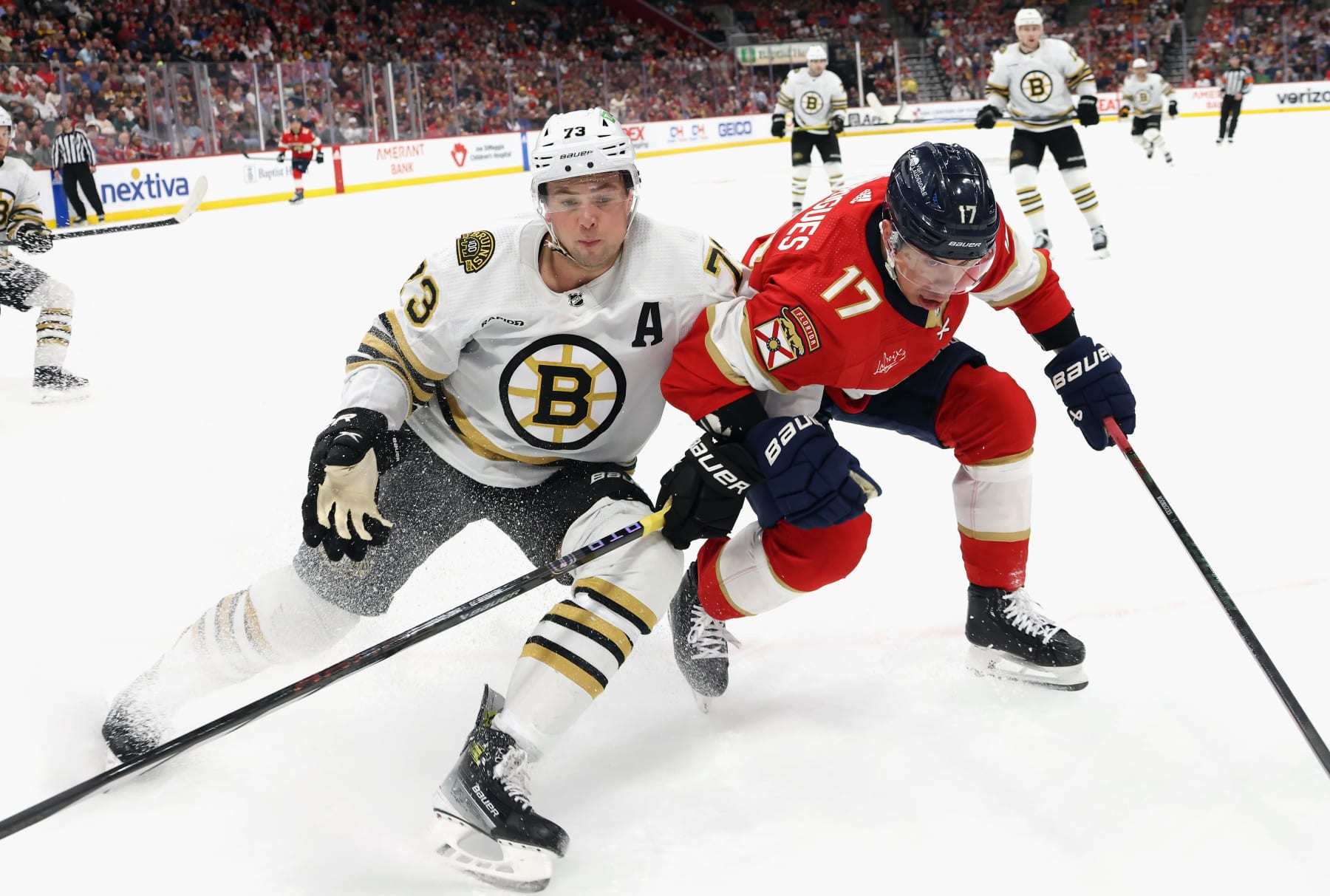 SUNRISE, FLORIDA - MARCH 26: Charlie McAvoy #73 of the Boston Bruins skates against Evan Rodrigues #17 of the Florida Panthers at Amerant Bank Arena on March 26, 2024 in Sunrise, Florida. (Photo by Bruce Bennett/Getty Images)