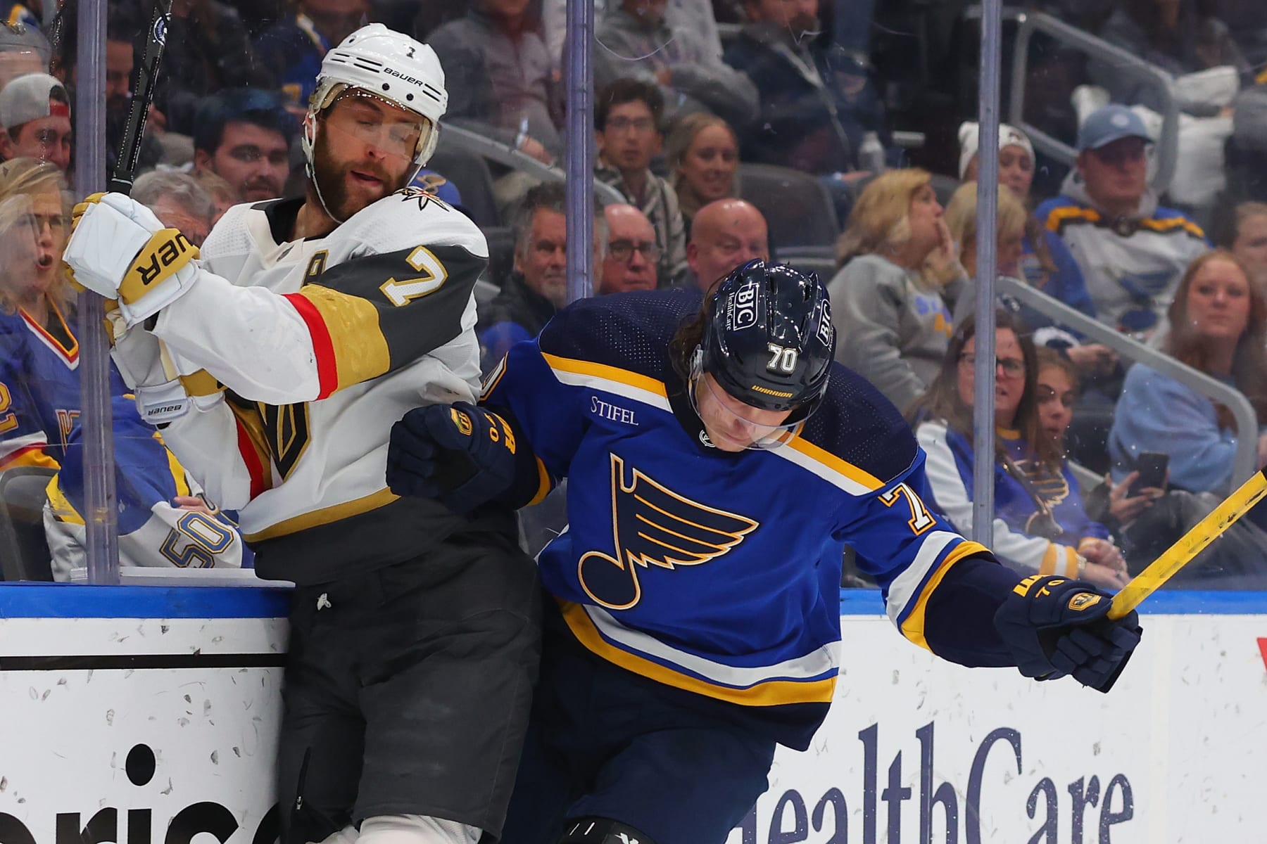 ST LOUIS, MISSOURI - DECEMBER 6: Oskar Sundqvist #70 of the St. Louis Blues checks Alex Pietrangelo #7 of the Vegas Golden Knights during the third period at Enterprise Center on December 6, 2023 in St Louis, Missouri. (Photo by Dilip Vishwanat/Getty Images)
