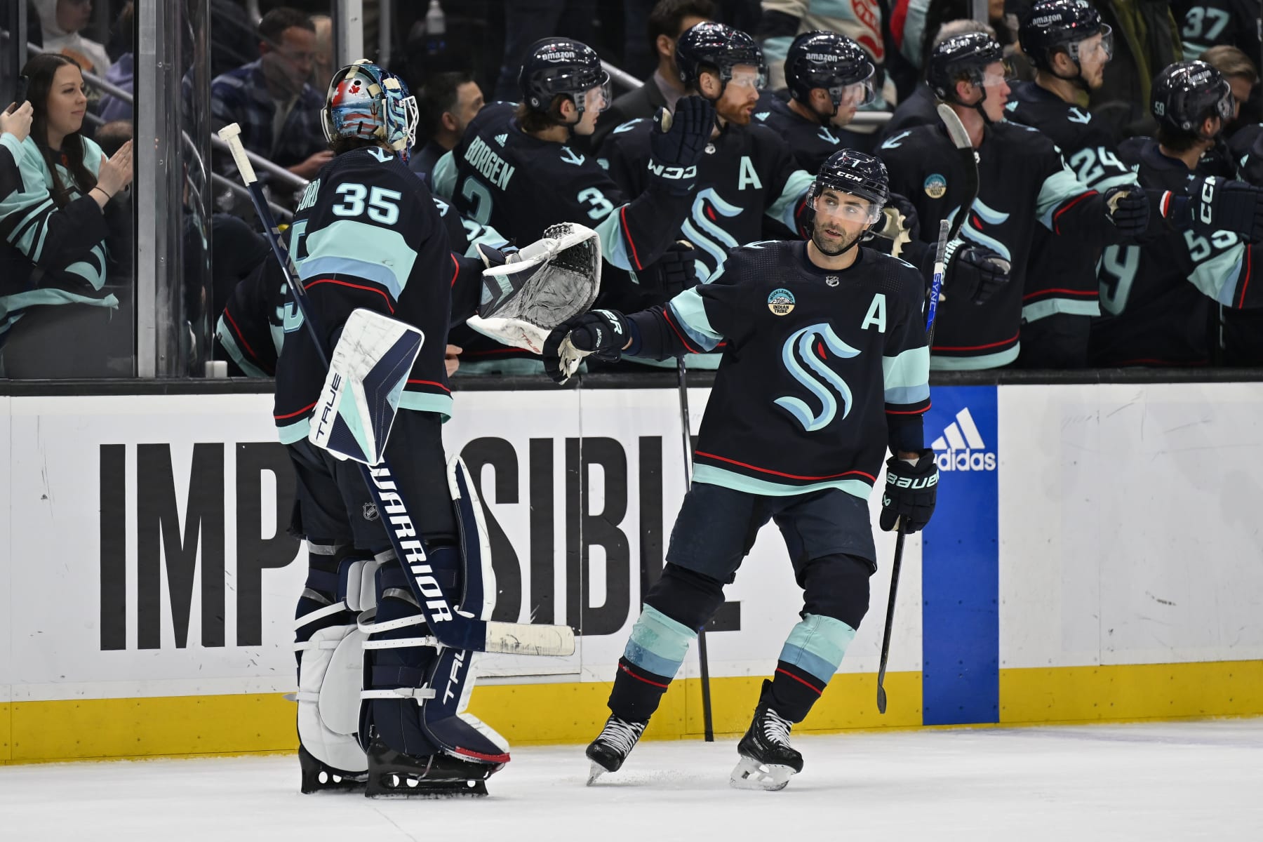 SEATTLE, WASHINGTON - MARCH 26: Jordan Eberle #7 of the Seattle Kraken celebrates with Joey Daccord #35 after scoring during the first period against the Anaheim Ducks at Climate Pledge Arena on March 26, 2024 in Seattle, Washington. (Photo by Alika Jenner/Getty Images)