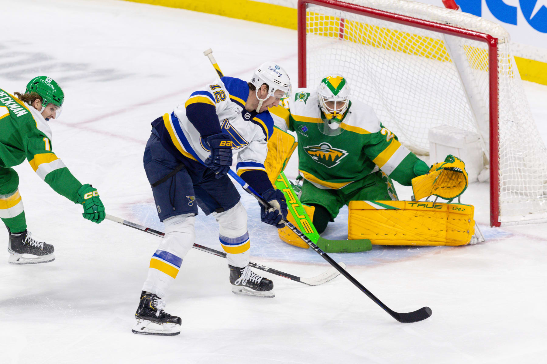 SAINT PAUL, MN - MARCH 23: St. Louis Blues right wing Kevin Hayes (12) takes a swing on Minnesota Wild goaltender Marc-Andre Fleury (29) during the second period of an NHL game between the St. Louis Blues and Minnesota Wild on March 23, 2024, at the Xcel Energy Center in Saint Paul, MN. (Photo by Bailey Hillesheim/Icon Sportswire via Getty Images)