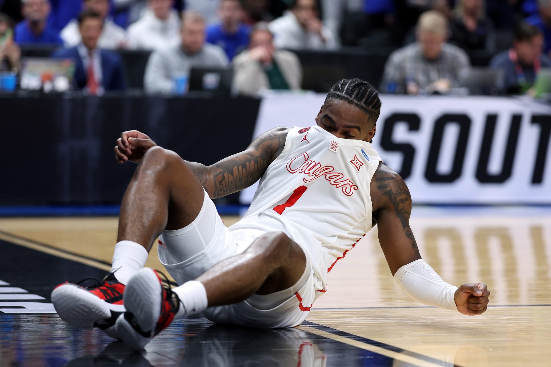 DALLAS, TEXAS - MARCH 29:  Jamal Shead #1 of the Houston Cougars falls to the ground during the 1st half of the Sweet 16 round of the NCAA Men's Basketball Tournament game against Duke Blue Devils at American Airlines Center on March 29, 2024 in Dallas, Texas. (Photo by Patrick Smith/Getty Images)