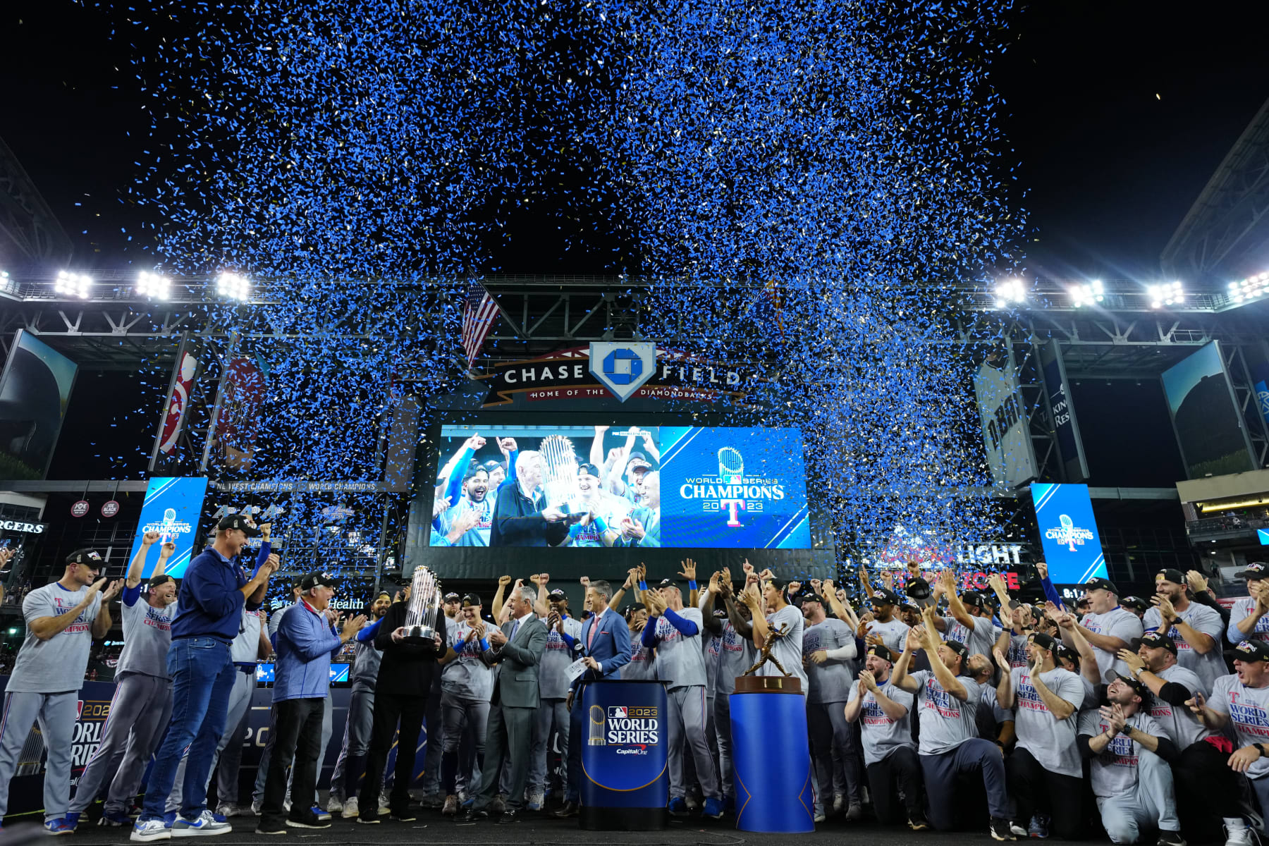 PHOENIX, AZ - NOVEMBER 01: Members of the Texas Rangers celebrate during the trophy presentation after Game 5 of the 2023 World Series between the Texas Rangers and the Arizona Diamondbacks at Chase Field on Wednesday, November 1, 2023 in Phoenix, Arizona. (Photo by Daniel Shirey/MLB Photos via Getty Images)