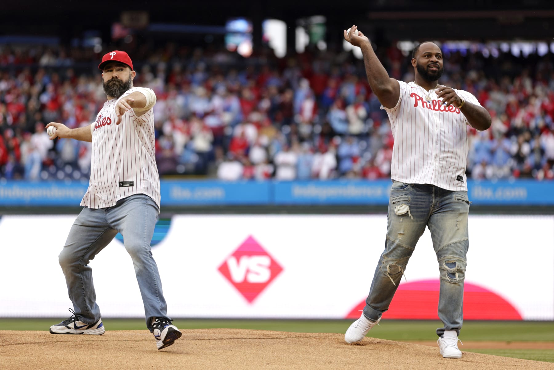 PHILADELPHIA, PENNSYLVANIA - MARCH 30: Recently retired Philadelphia Eagles legends Jason Kelce and Fletcher Cox throw out the first pitch before a game between the Atlanta Braves and Philadelphia Phillies at Citizens Bank Park on March 30, 2024 in Philadelphia, Pennsylvania. (Photo by Rich Schultz/Getty Images)