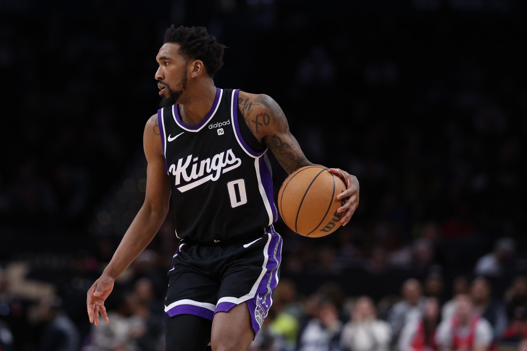 WASHINGTON, DC - MARCH 21: Malik Monk #0 of the Sacramento Kings dribbles the ball against the Washington Wizards during the second half at Capital One Arena on March 21, 2024 in Washington, DC. NOTE TO USER: User expressly acknowledges and agrees that, by downloading and or using this photograph, User is consenting to the terms and conditions of the Getty Images License Agreement. (Photo by Patrick Smith/Getty Images)