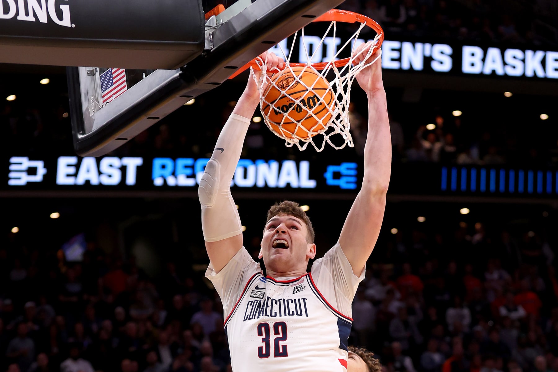 BOSTON, MASSACHUSETTS - MARCH 30: Donovan Clingan #32 of the Connecticut Huskies dunks the ball against the Illinois Fighting Illini in the Elite 8 round of the NCAA Men's Basketball Tournament at TD Garden on March 30, 2024 in Boston, Massachusetts. (Photo by Michael Reaves/Getty Images)