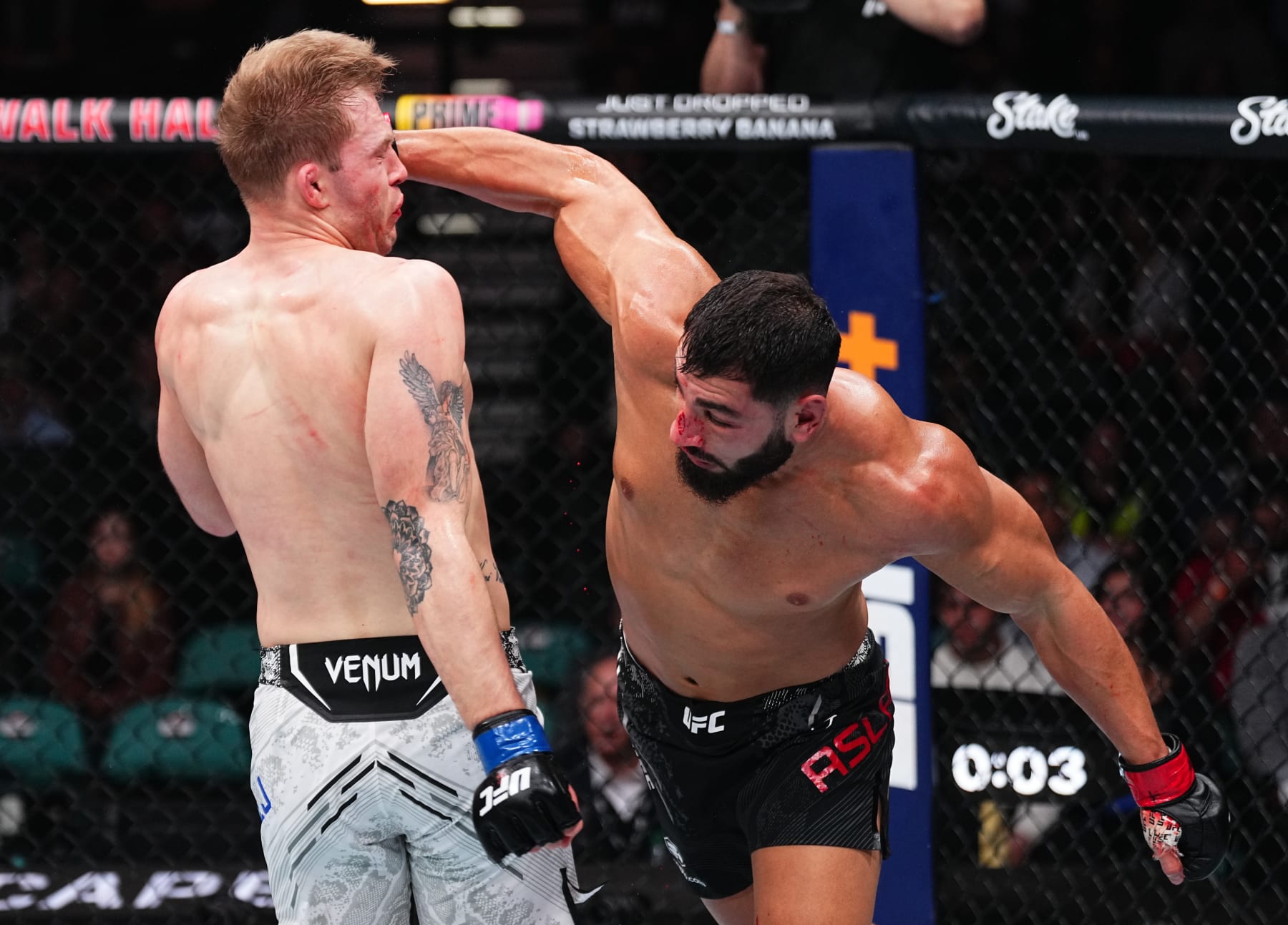 ATLANTIC CITY, NEW JERSEY - MARCH 30: (R-L) Ibo Aslan of Turkey punches Anton Turkalj of Sweden in a featherweight bout during the UFC Fight Night event at Boardwalk Hall Arena on March 30, 2024 in Atlantic City, New Jersey. (Photo by Jeff Bottari/Zuffa LLC via Getty Images)