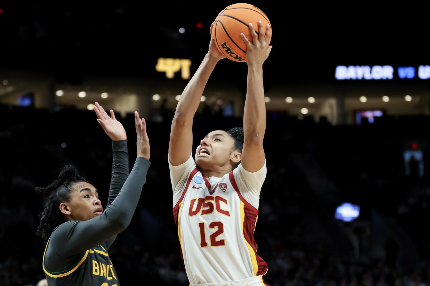 PORTLAND, OREGON - MARCH 30: JuJu Watkins #12 of the USC Trojans drives past Bella Fontleroy #22 of the Baylor Lady Bears during the first half in the Sweet 16 round of the NCAA Women's Basketball Tournament at Moda Center on March 30, 2024 in Portland, Oregon. (Photo by Steph Chambers/Getty Images)