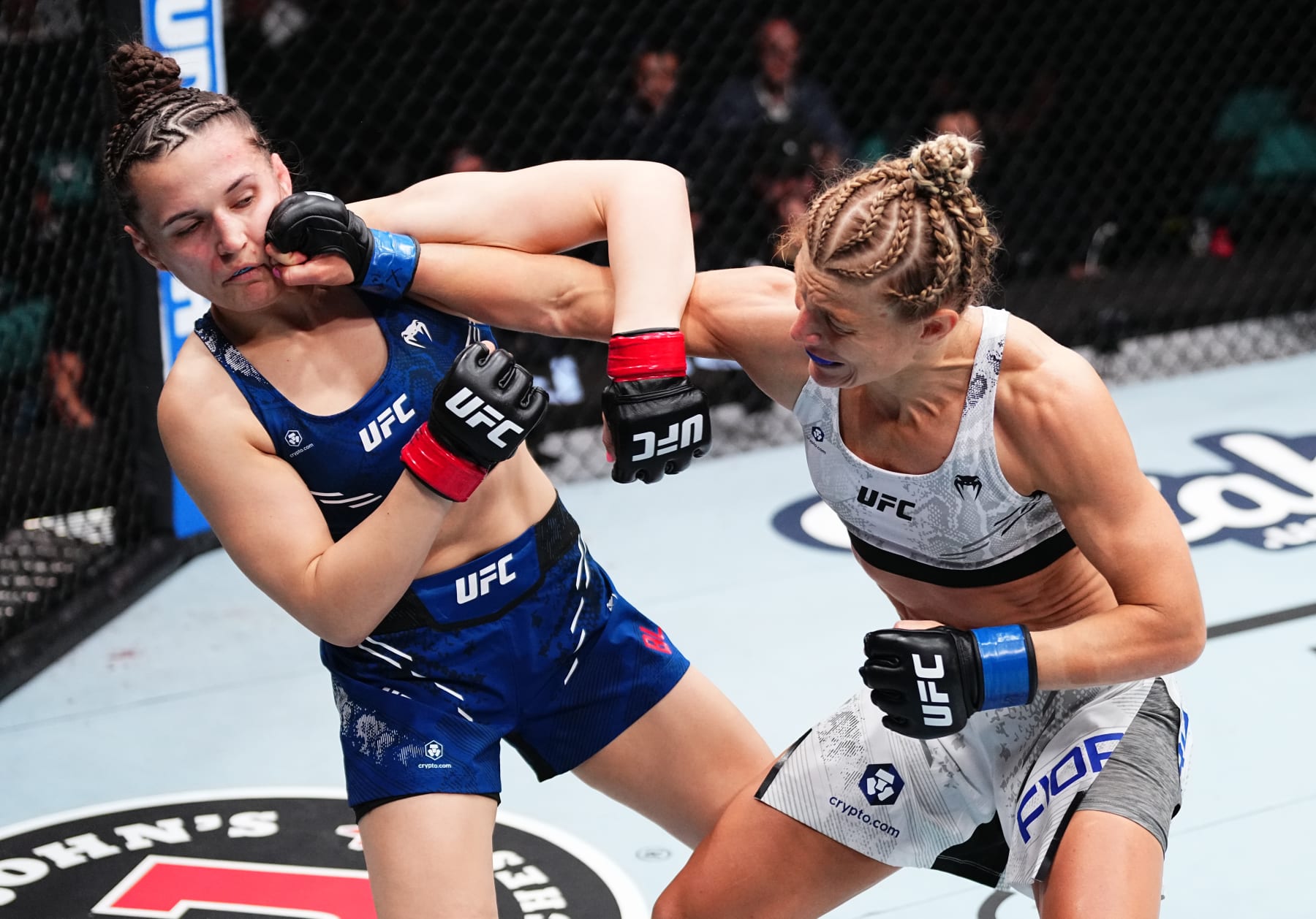 ATLANTIC CITY, NEW JERSEY - MARCH 30: (R-L) Manon Fiorot of France punches Erin Blanchfield in a flyweight bout during the UFC Fight Night event at Boardwalk Hall Arena on March 30, 2024 in Atlantic City, New Jersey. (Photo by Jeff Bottari/Zuffa LLC via Getty Images)