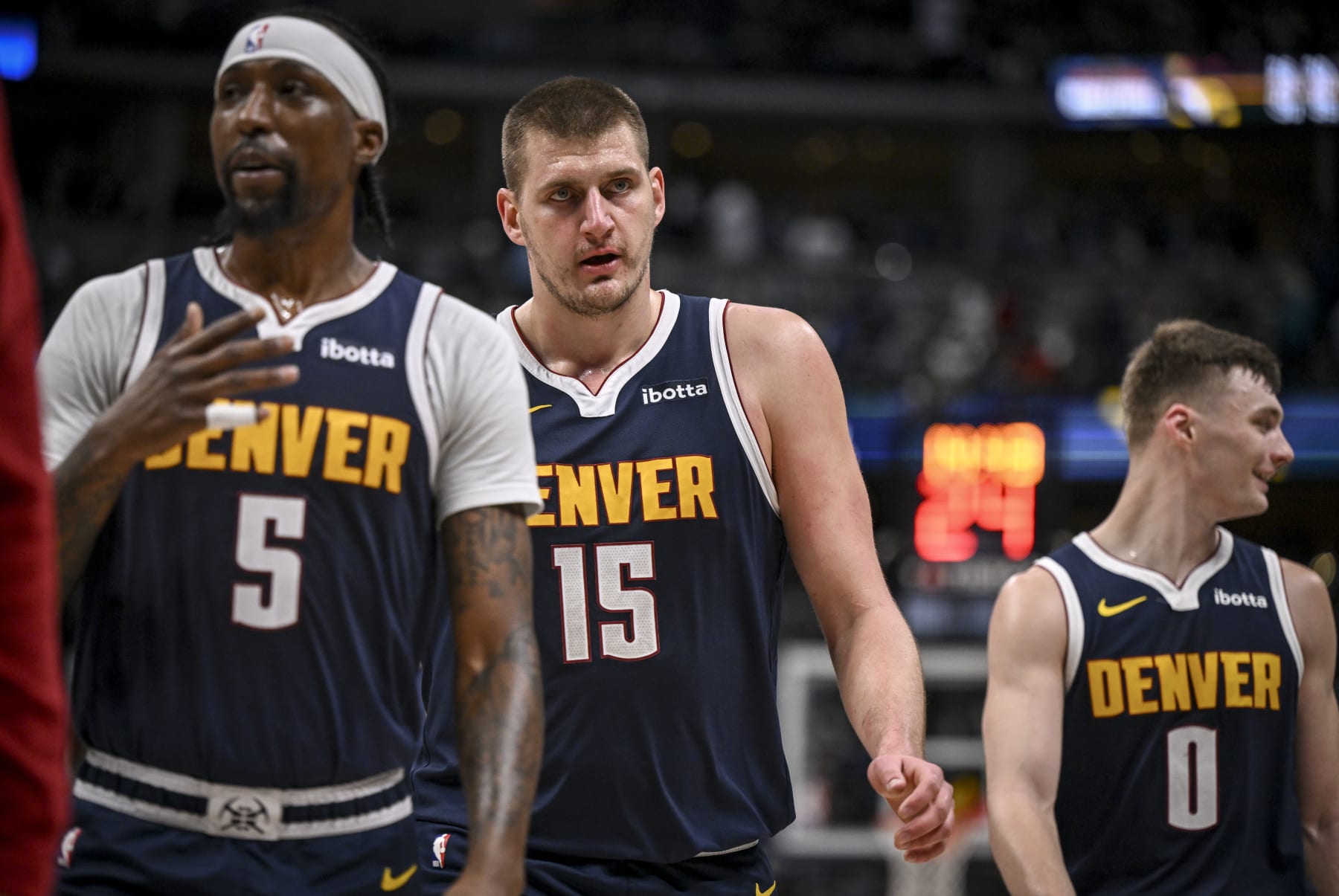 DENVER, CO - MARCH 31: Kentavious Caldwell-Pope (5), Nikola Jokic (15) and Christian Braun (0) of the Denver Nuggets walk off the court after the second quarter against the Cleveland Cavaliers at Ball Arena in Denver on Sunday, March 31, 2024. (Photo by AAron Ontiveroz/The Denver Post)