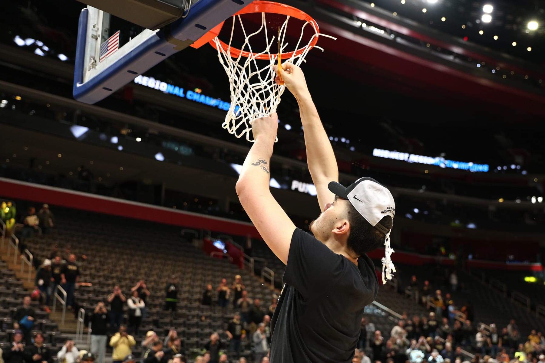 DETROIT, MICHIGAN - MARCH 31: Zach Edey #15 of the Purdue Boilermakers cuts down the net after defeating the Tennessee Volunteers in the Elite 8 round of the NCAA Men's Basketball Tournament at Little Caesars Arena on March 31, 2024 in Detroit, Michigan. (Photo by Mike Mulholland/Getty Images)