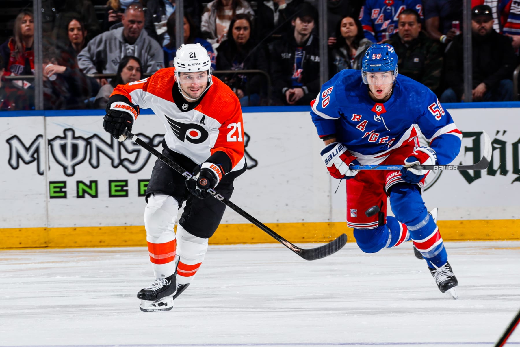 NEW YORK, NEW YORK - MARCH 26: Scott Laughton #21 of the Philadelphia Flyers skates against Will Cuylle #50 of the New York Rangers at Madison Square Garden on March 26, 2024 in New York City. (Photo by Jared Silber/NHLI via Getty Images)