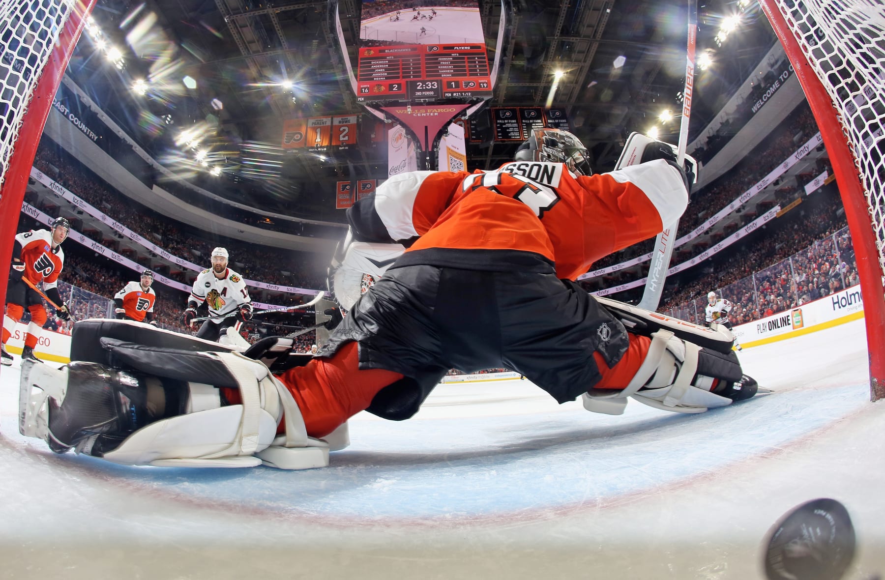 PHILADELPHIA, PENNSYLVANIA - MARCH 30: Goaltender Samuel Ersson #33 of the Philadelphia Flyers surrenders a second period power-play goal to Nick Foligno #17 of the Chicago Blackhawks at the Wells Fargo Center on March 30, 2024 in Philadelphia, Pennsylvania. (Photo by Len Redkoles/NHLI via Getty Images)