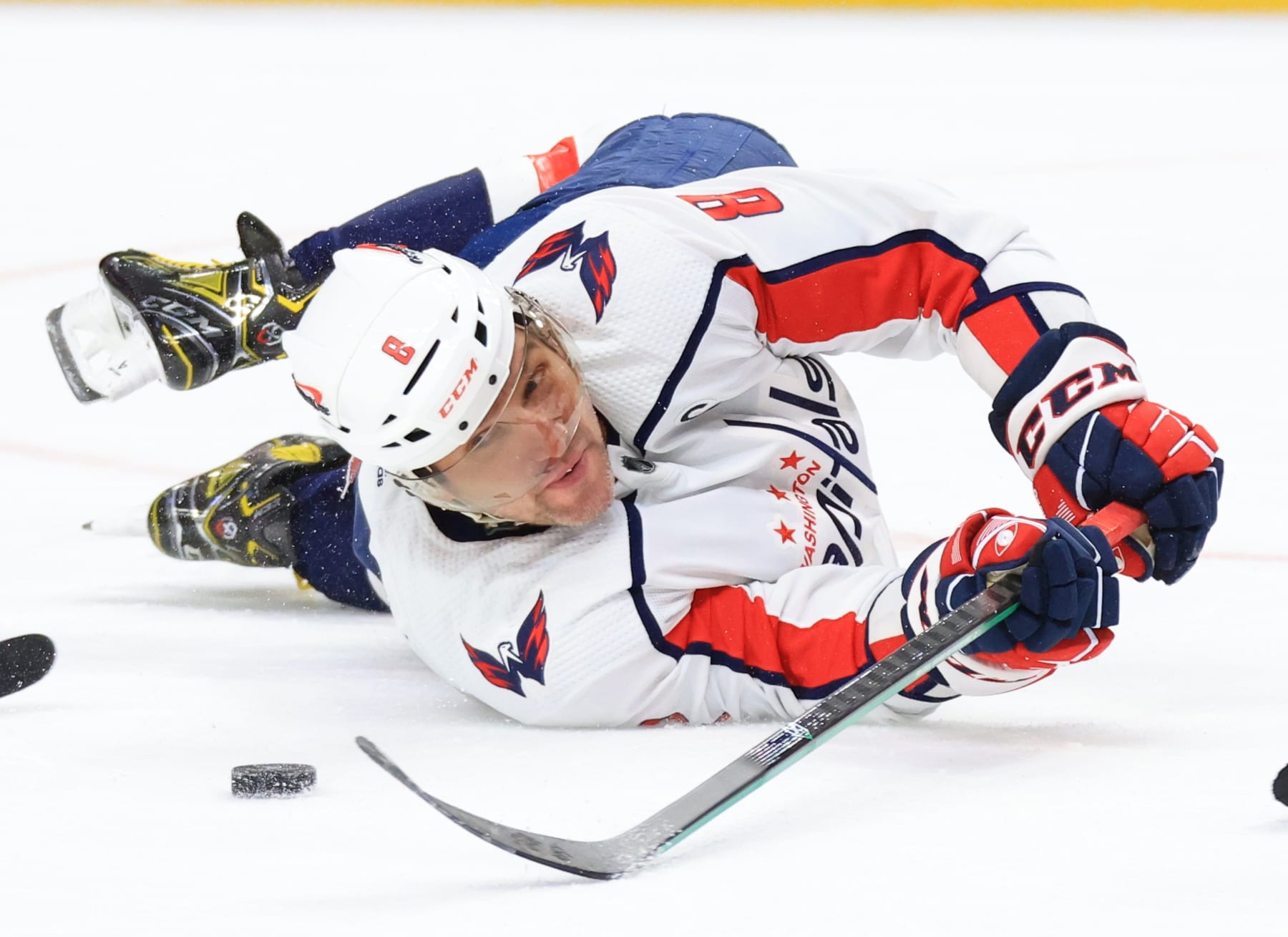 BUFFALO, NEW YORK - APRIL 2: Alex Ovechkin #8 of the Washington Capitals battles for the puck while laying on the ice during an NHL game against the Buffalo Sabres on April 2, 2024 at KeyBank Center in Buffalo, New York. (Photo by Bill Wippert/NHLI via Getty Images)