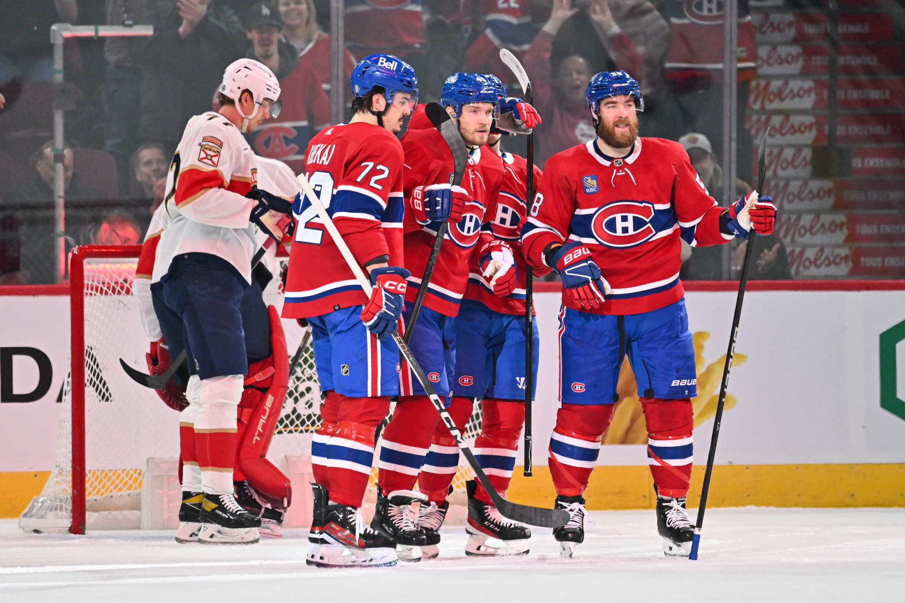 MONTREAL, CANADA - APRIL 02: Joel Armia #40 of the Montreal Canadiens celebrates his goal with teammates Arber Xhekaj #72 and David Savard #58 during the first period against the Florida Panthers at the Bell Centre on April 2, 2024 in Montreal, Quebec, Canada. (Photo by Minas Panagiotakis/Getty Images)