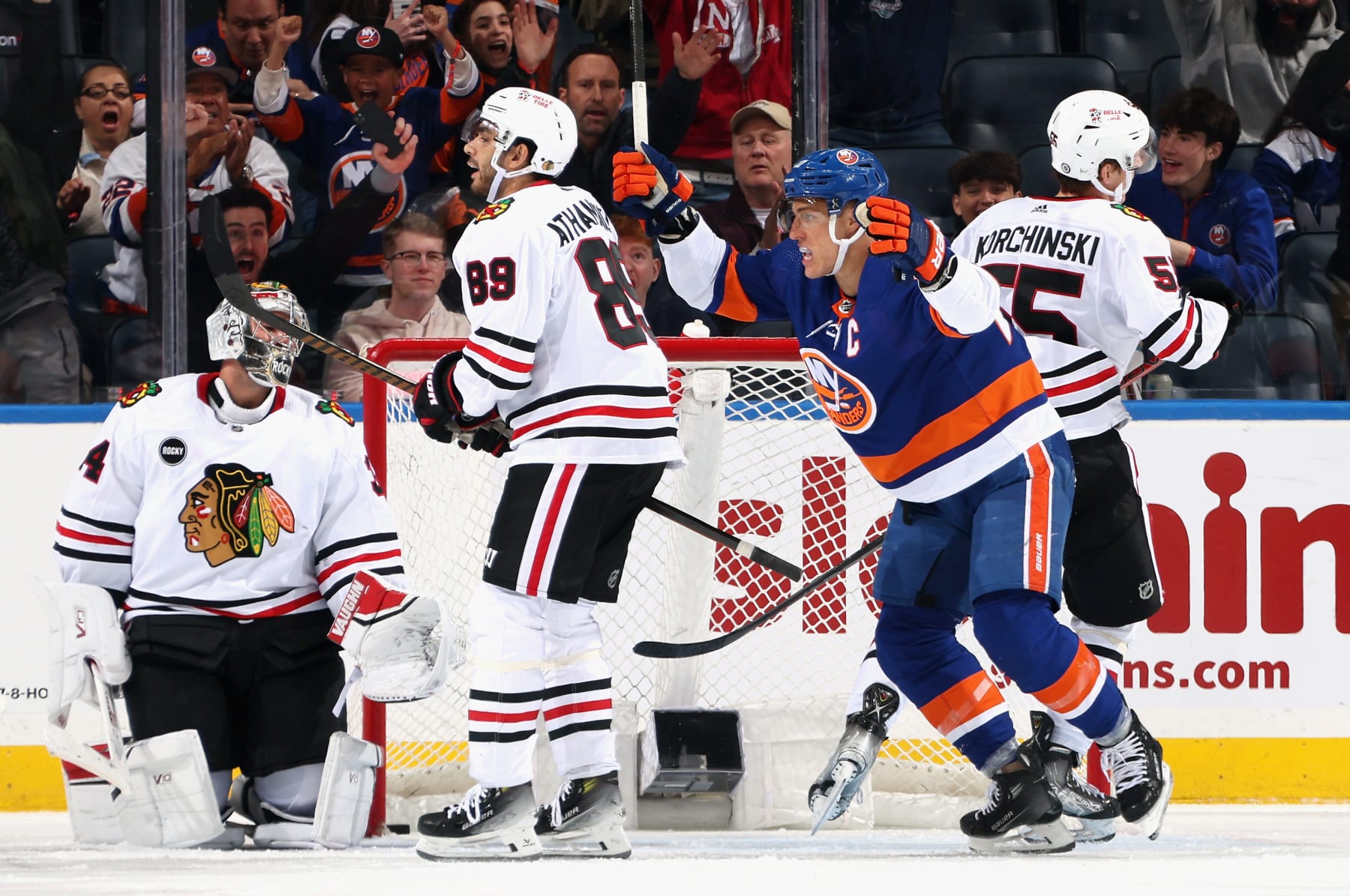 ELMONT, NEW YORK - APRIL 02: Anders Lee #27 of the New York Islanders celebrates a third period goal by Simon Holmstrom #10 against the Chicago Blackhawks at UBS Arena on April 02, 2024 in Elmont, New York. (Photo by Bruce Bennett/Getty Images)