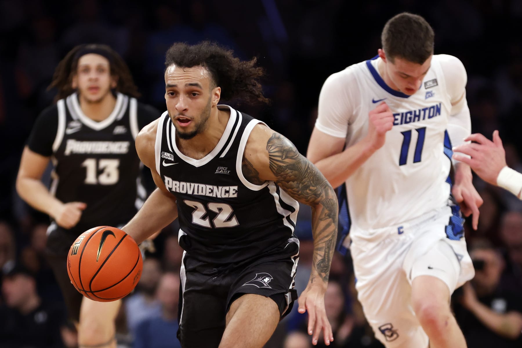 NEW YORK, NEW YORK - MARCH 14: Devin Carter #22 of the Providence Friars dribbles in the first half against the Creighton Bluejays during the Quarterfinals of the Big East Basketball Tournament at Madison Square Garden on March 14, 2024 in New York City. (Photo by Sarah Stier/Getty Images)