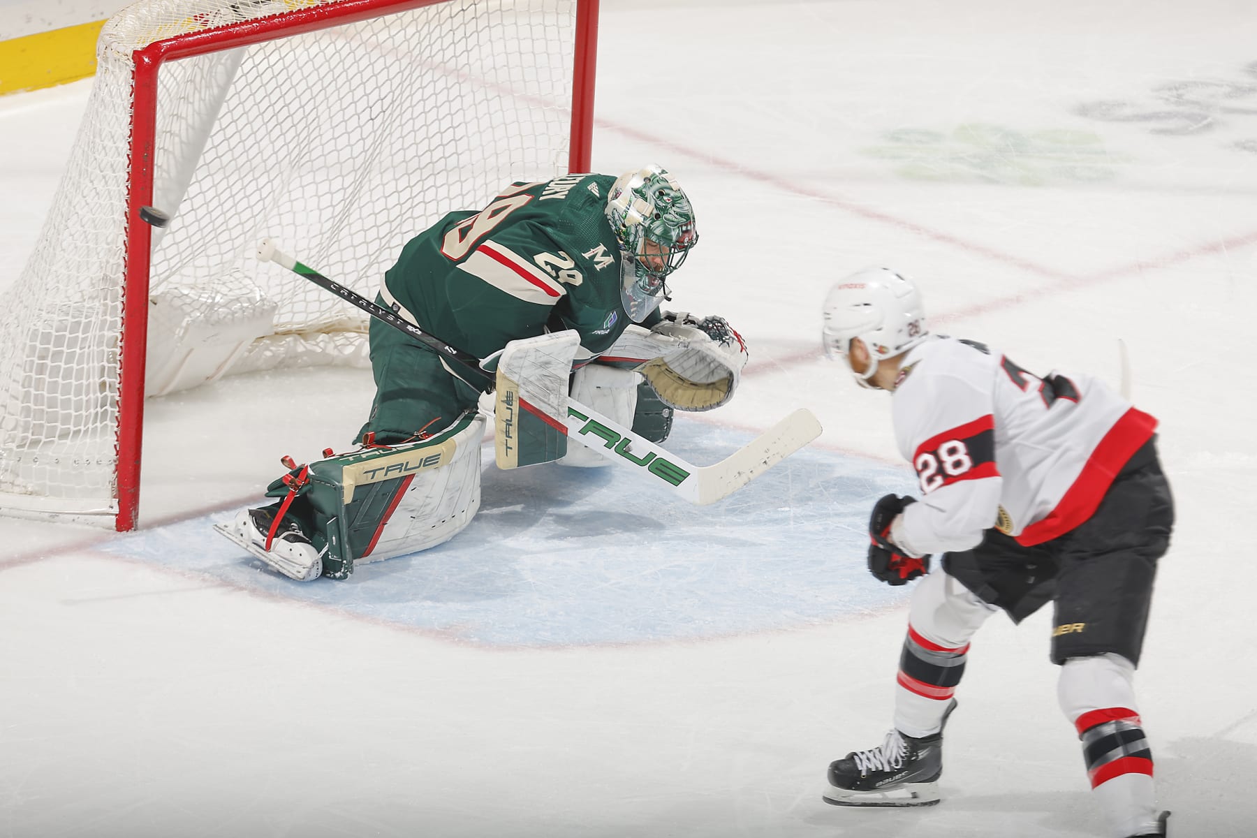 SAINT PAUL, MN - APRIL 2: Marc-Andre Fleury #29 of the Minnesota Wild makes a save against Claude Giroux #28 of the Ottawa Senators during the game at the Xcel Energy Center on April 2, 2024 in Saint Paul, Minnesota. (Photo by Bruce Kluckhohn/NHLI via Getty Images)