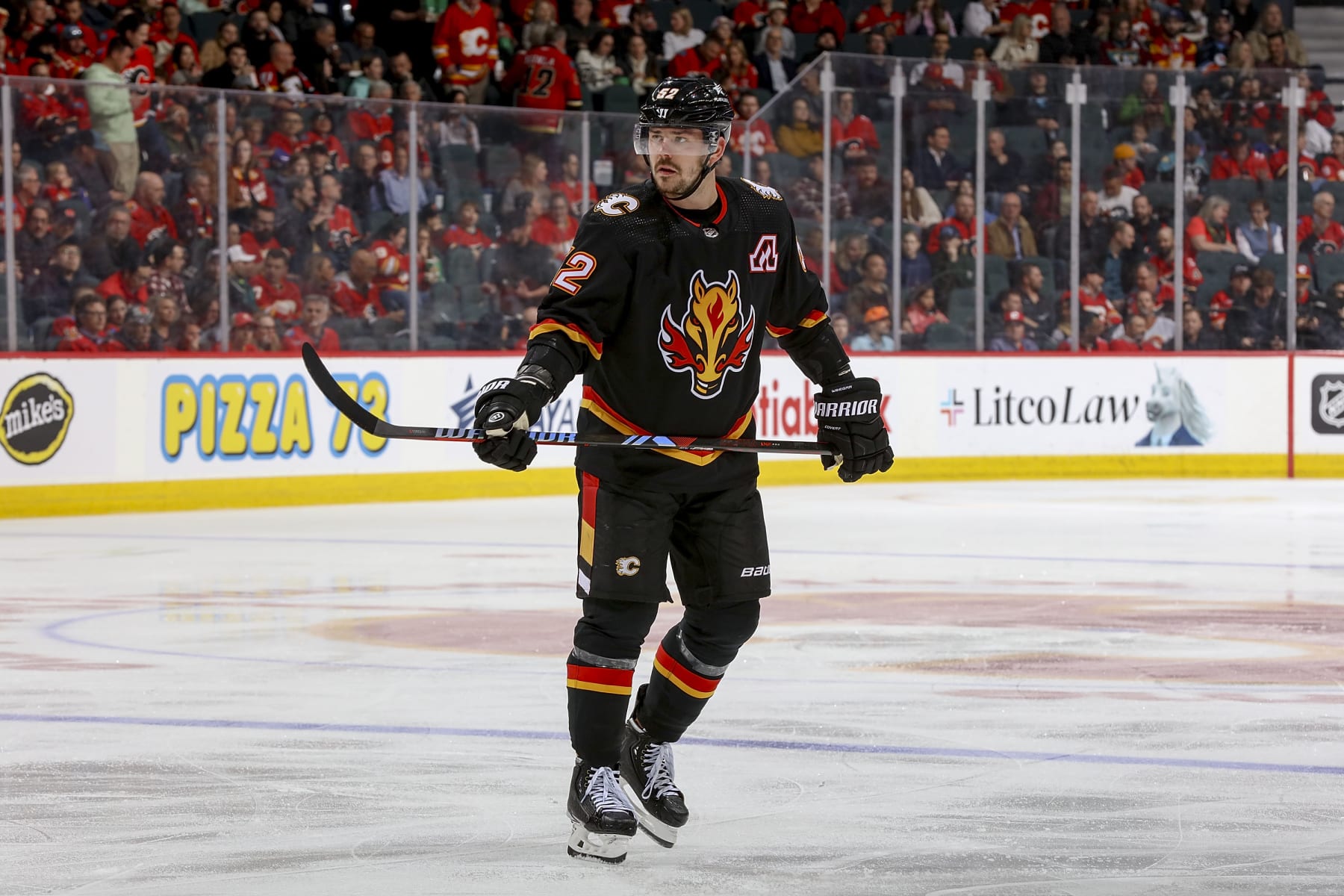 CALGARY, AB - APRIL 2: MacKenzie Weegar #52 of the Calgary Flames skates up ice against the Anaheim Ducks at Scotiabank Saddledome on April 2, 2024 in Calgary, Alberta, Canada. (Photo by Gerry Thomas/NHLI via Getty Images)
