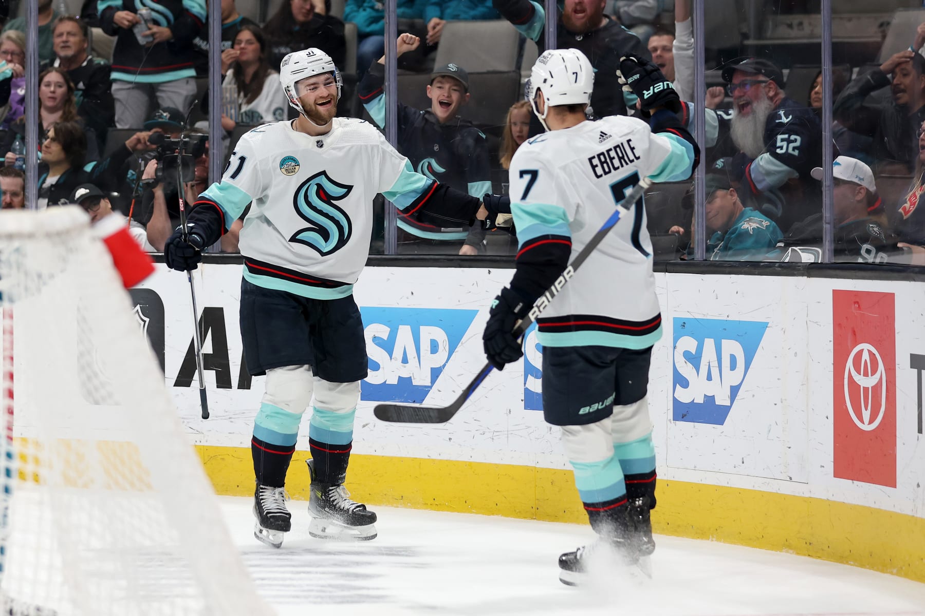 SAN JOSE, CALIFORNIA - APRIL 01: Shane Wright #51 is congratulated by Jordan Eberle #7 of the Seattle Kraken after he scored against the San Jose Sharks in the first period at SAP Center on April 01, 2024 in San Jose, California. (Photo by Ezra Shaw/Getty Images)