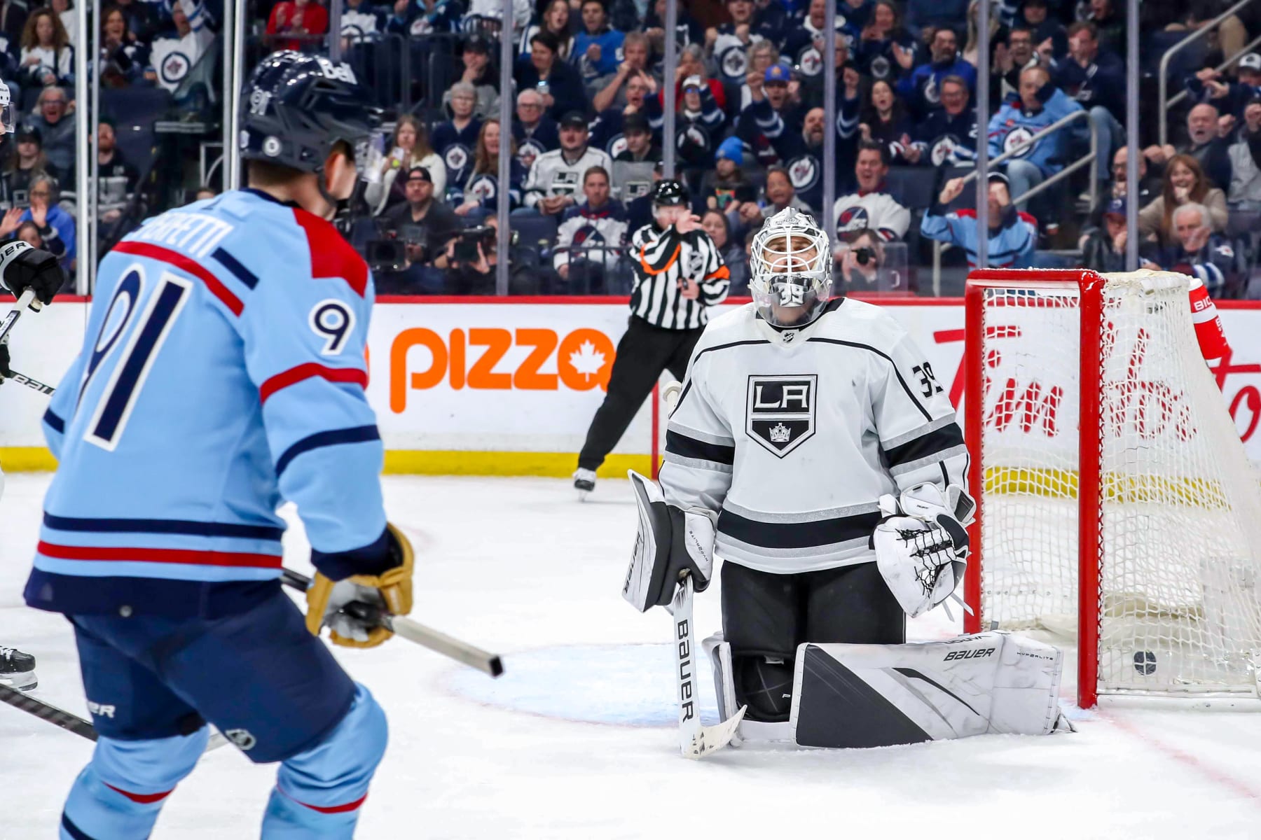 WINNIPEG, CANADA - APRIL 1: Cole Perfetti #91 of the Winnipeg Jets looks on after scoring a third period goal against goaltender Cam Talbot #39 of the Los Angeles Kings at the Canada Life Centre on April 1, 2024 in Winnipeg, Manitoba, Canada. (Photo by Darcy Finley/NHLI via Getty Images)