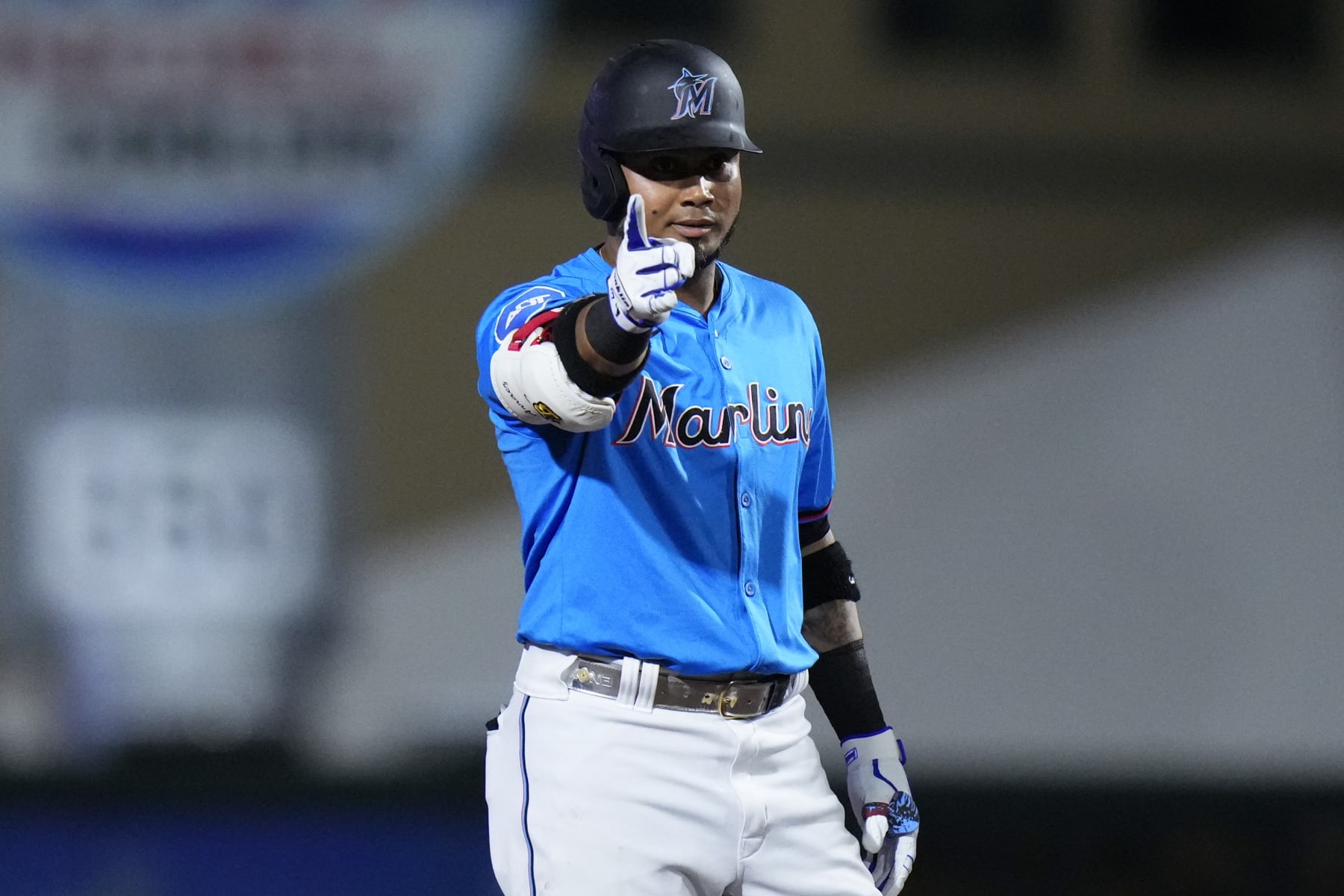 JUPITER, FLORIDA - MARCH 08: Luis Arraez #3 of the Miami Marlins celebrates hitting a double against the New York Mets during the first inning of a spring training game at Roger Dean Stadium on March 08, 2024 in Jupiter, Florida. (Photo by Rich Storry/Getty Images)