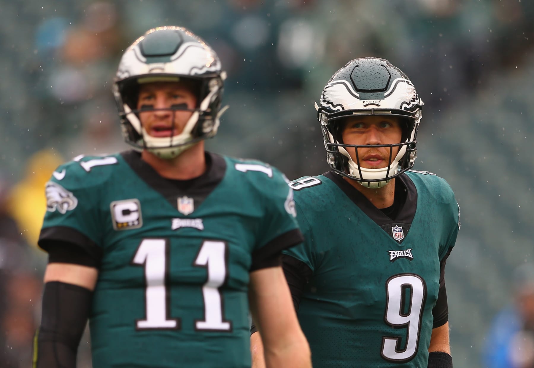 PHILADELPHIA, PA - SEPTEMBER 23:  (L-R) Quarterback Carson Wentz #11 of the Philadelphia Eagles and teammate quarterback Nick Foles #9 look on during warm ups before taking on the Indianapolis Colts at Lincoln Financial Field on September 23, 2018 in Philadelphia, Pennsylvania.  (Photo by Mitchell Leff/Getty Images)