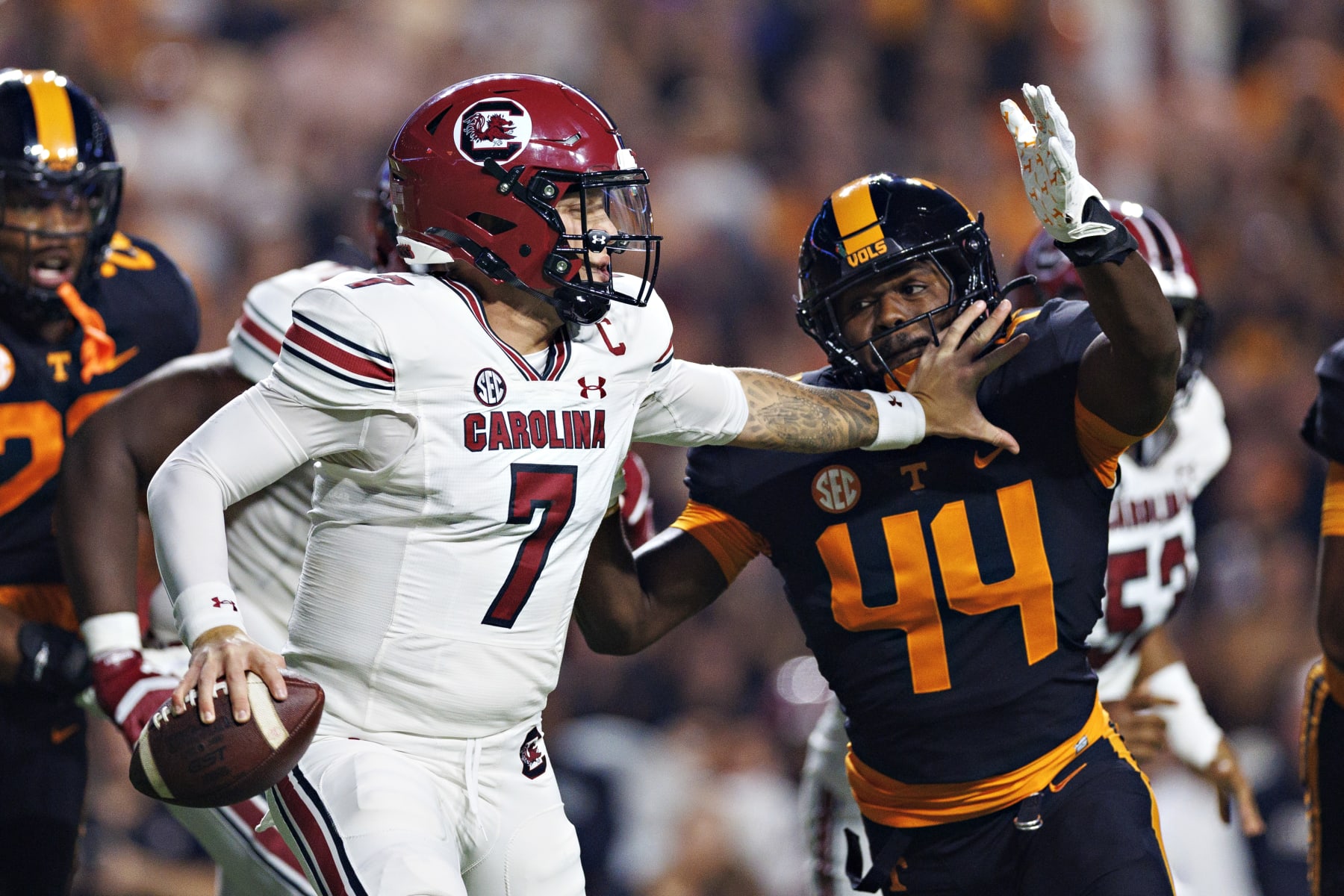 KNOXVILLE, TENNESSEE - SEPTEMBER 30: Spencer Rattler #7 of the South Carolina Gamecocks rolls out to pass during the game against the Tennessee Volunteers at Neyland Stadium on September 30, 2023 in Knoxville, Tennessee. The Volunteers defeated the Gamecocks 41-20. (Photo by Wesley Hitt/Getty Images)