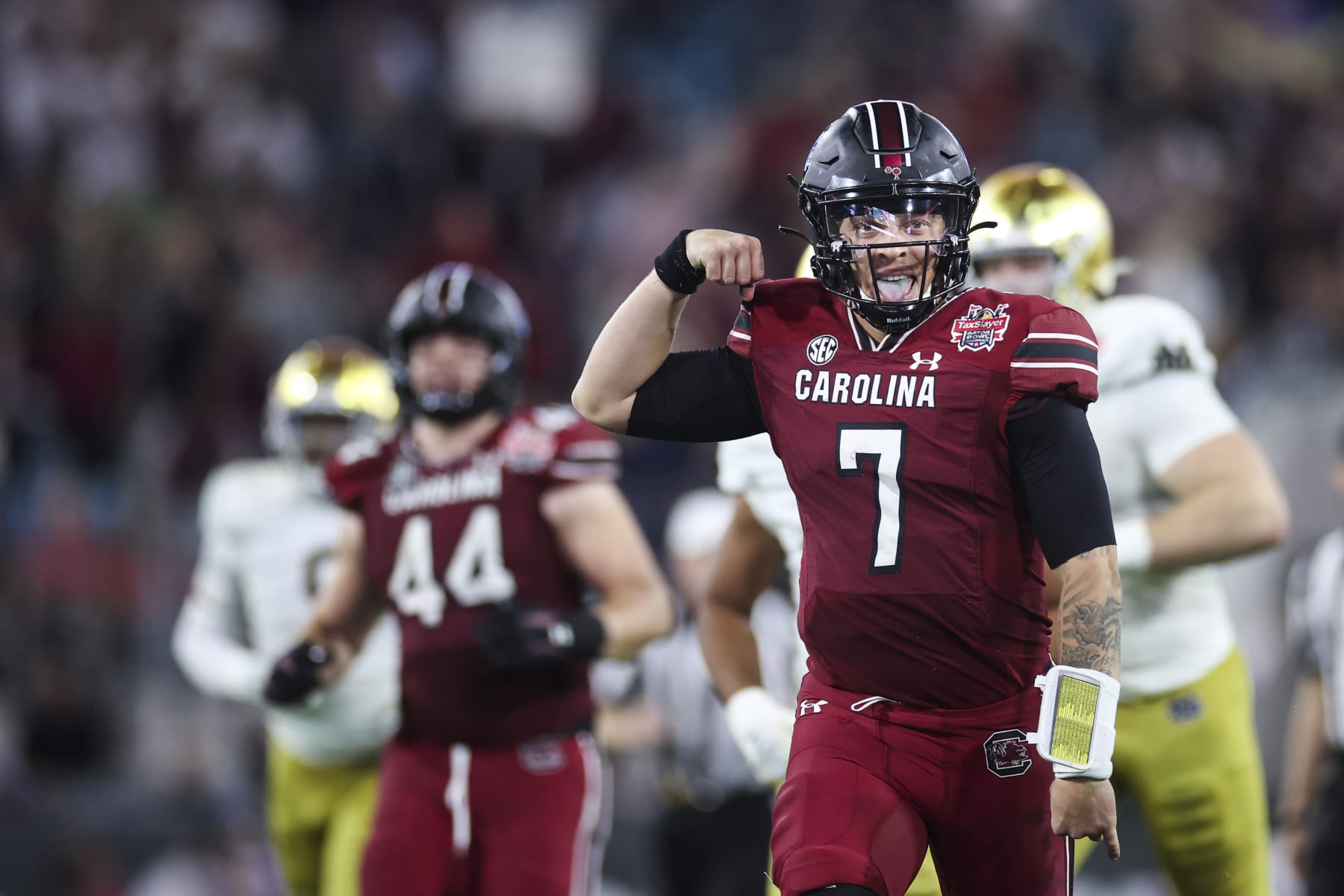 JACKSONVILLE, FLORIDA - DECEMBER 30: Spencer Rattler #7 of the South Carolina Gamecocks celebrates after scoring a touchdown against the Notre Dame Fighting Irish during the second half of the TaxSlayer Gator Bowl at TIAA Bank Field on December 30, 2022 in Jacksonville, Florida. (Photo by James Gilbert/Getty Images)