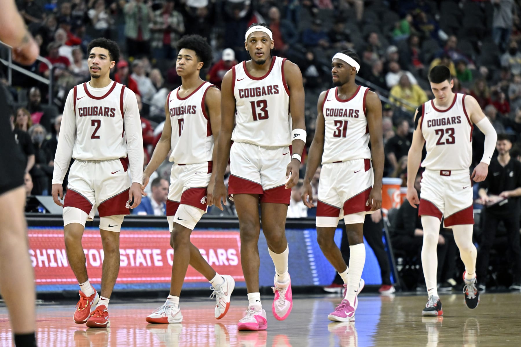 LAS VEGAS, NEVADA - MARCH 15: Myles Rice #2, Jaylen Wells #0, Isaac Jones #13, Kymany Houinsou #31 and Andrej Jakimovski #23 of the Washington State Cougars walk on the court after a timeout against the Colorado Buffaloes in the second half of a semifinal game during the the Pac-12 Conference basketball tournament at T-Mobile Arena on March 15, 2024 in Las Vegas, Nevada. The Buffaloes defeated the Cougars 58-52. (Photo by David Becker/Getty Images)