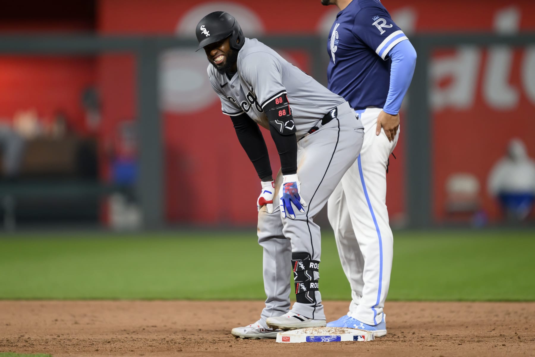 KANSAS CITY, MISSOURI - APRIL 5: Luis Robert Jr. #88 of the Chicago White Sox grimaces after hitting a double against the Kansas City Royals at Kauffman Stadium on April 5, 2024 in Kansas City, Missouri. He would leave the game after that hit. (Photo by Reed Hoffmann/Getty Images)
