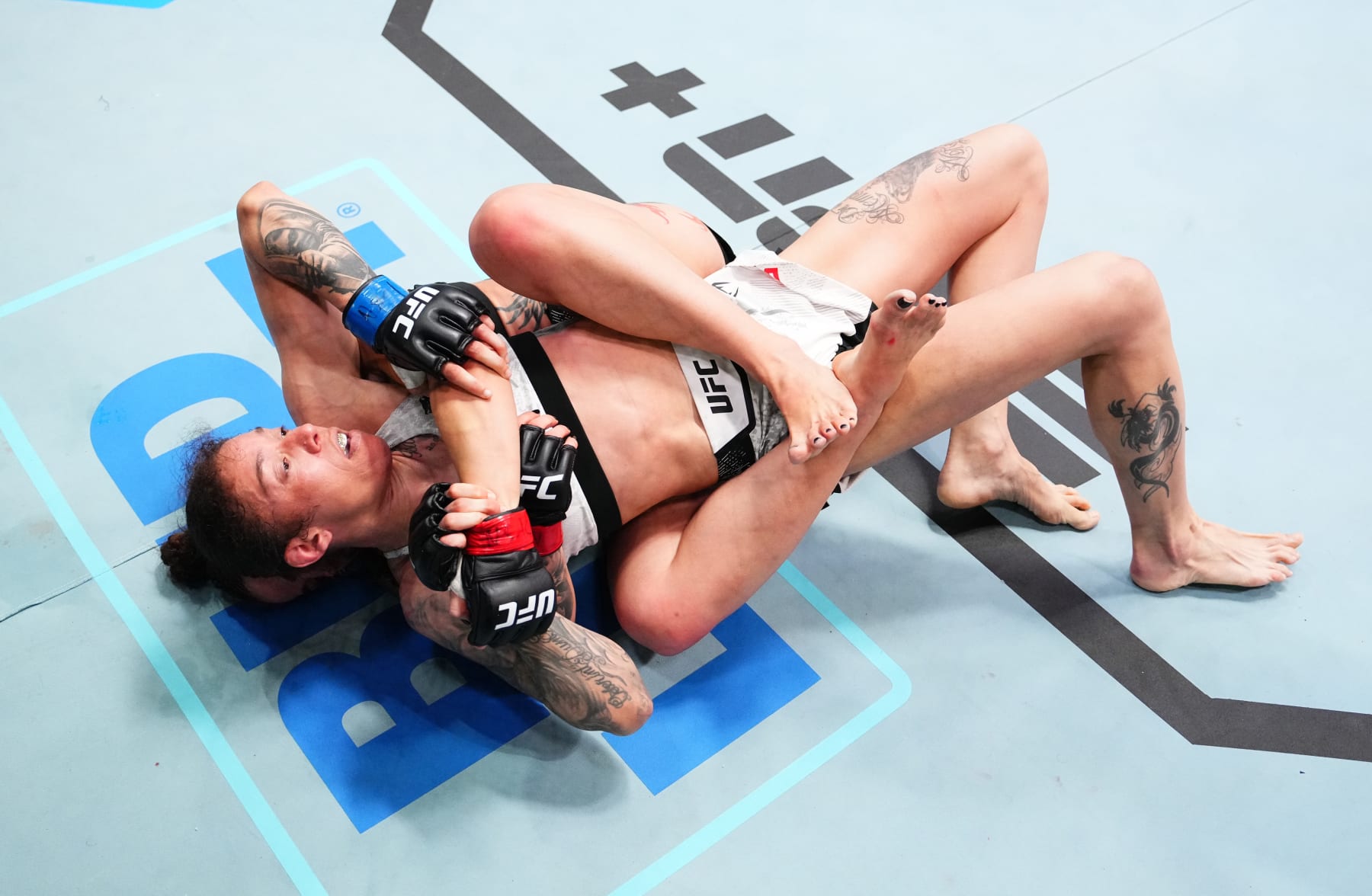 LAS VEGAS, NEVADA - APRIL 06: (L-R) Norma Dumont of Brazil grapples Germaine de Randamie of The Netherlands in a bantamweight fight during the UFC Fight Night event at UFC APEX on April 06, 2024 in Las Vegas, Nevada. (Photo by Jeff Bottari/Zuffa LLC via Getty Images)