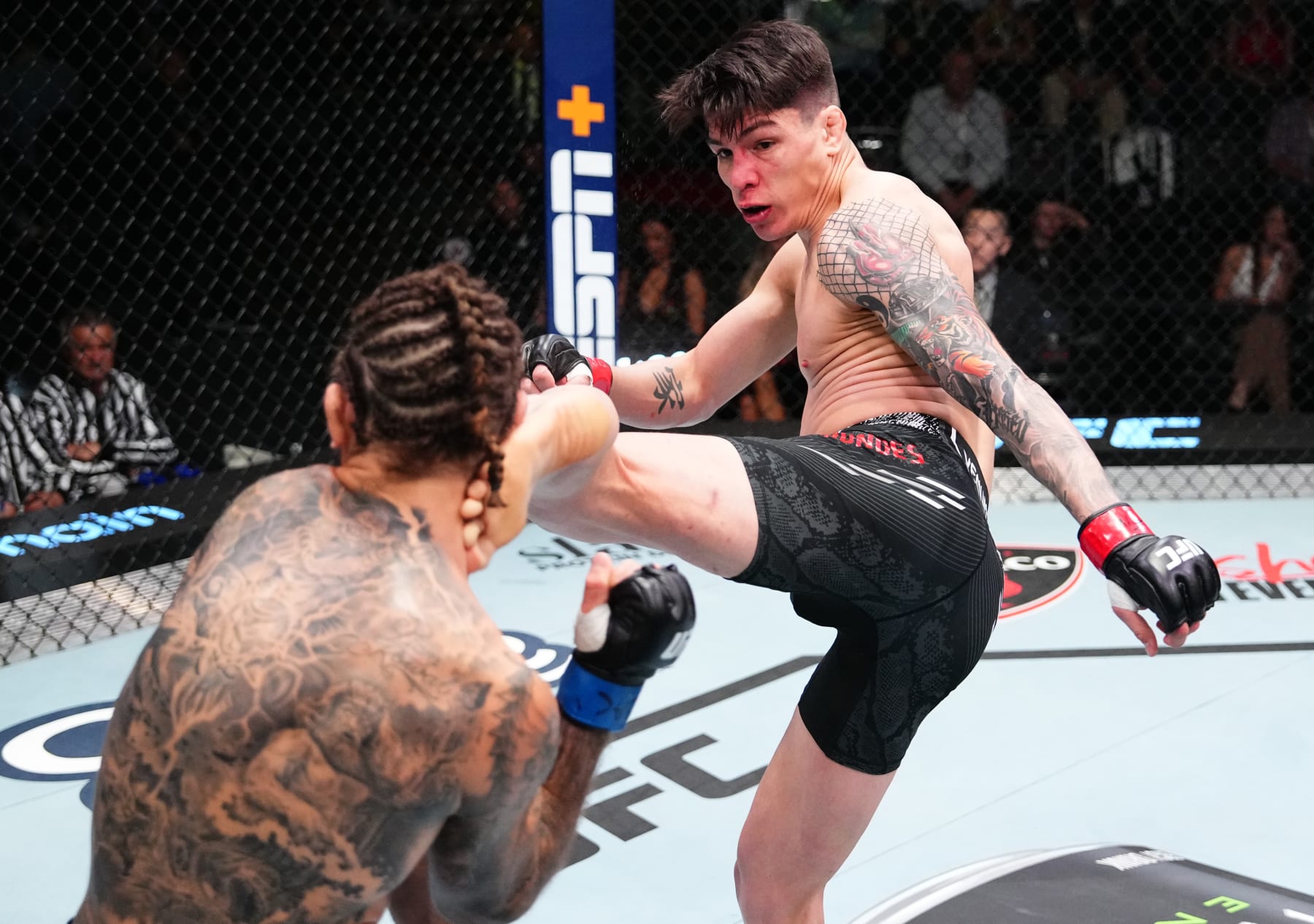 LAS VEGAS, NEVADA - APRIL 06: (R-L) Ignacio Bahamondes of Chile kicks Christos Giagos in a lightweight fight during the UFC Fight Night event at UFC APEX on April 06, 2024 in Las Vegas, Nevada. (Photo by Jeff Bottari/Zuffa LLC via Getty Images)