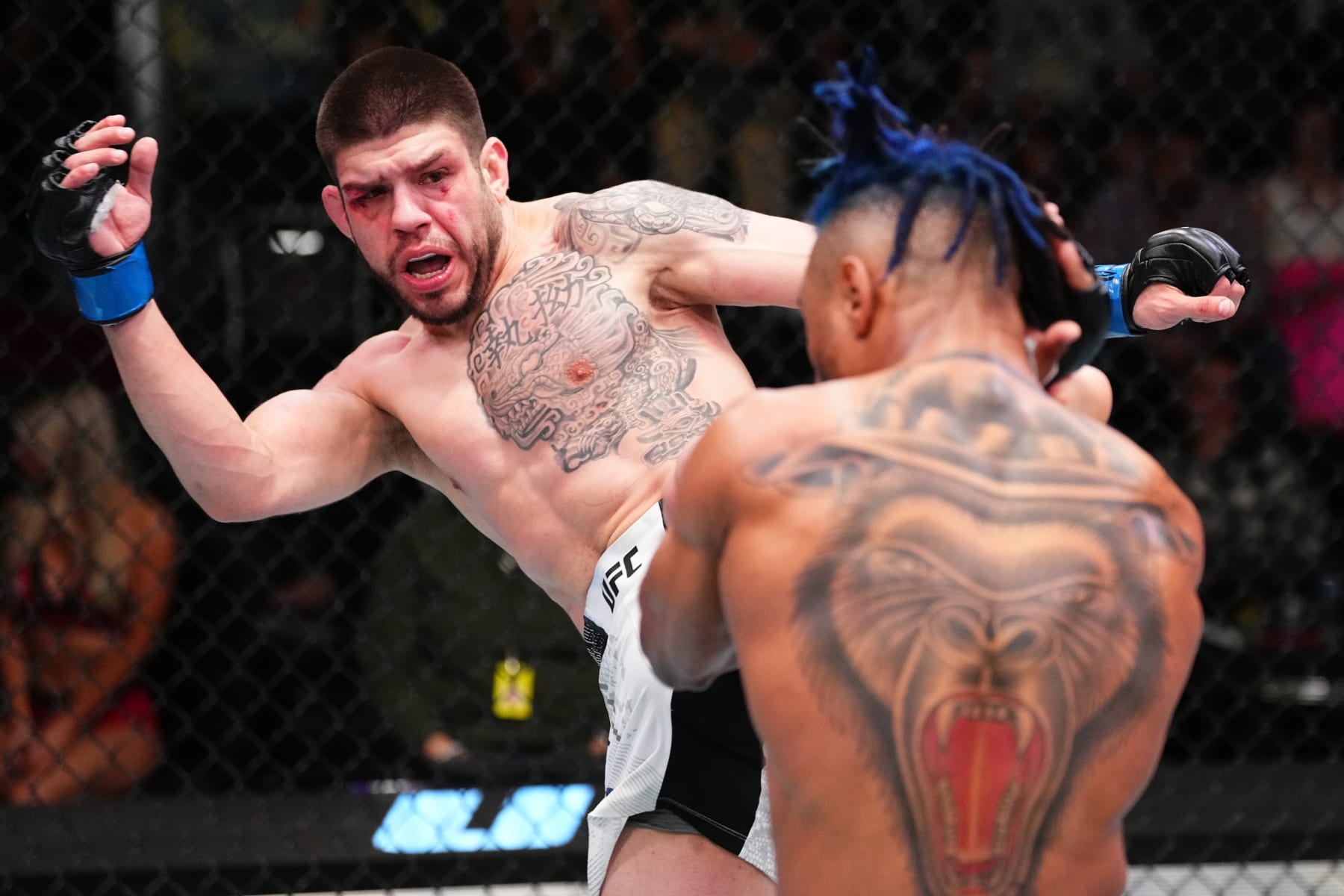 LAS VEGAS, NEVADA - APRIL 06: (L-R) Chepe Mariscal kicks Morgan Charriere of France in a featherweight fight during the UFC Fight Night event at UFC APEX on April 06, 2024 in Las Vegas, Nevada. (Photo by Jeff Bottari/Zuffa LLC via Getty Images)