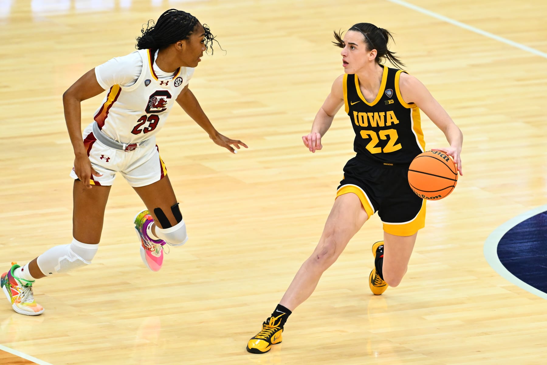 CLEVELAND, OHIO - APRIL 07: Caitlin Clark #22 of the Iowa Hawkeyes dribbles around Bree Hall #23 of the South Carolina Gamecocks in the first half during the 2024 NCAA Women's Basketball Tournament National Championship at Rocket Mortgage FieldHouse on April 07, 2024 in Cleveland, Ohio. (Photo by Jason Miller/Getty Images)