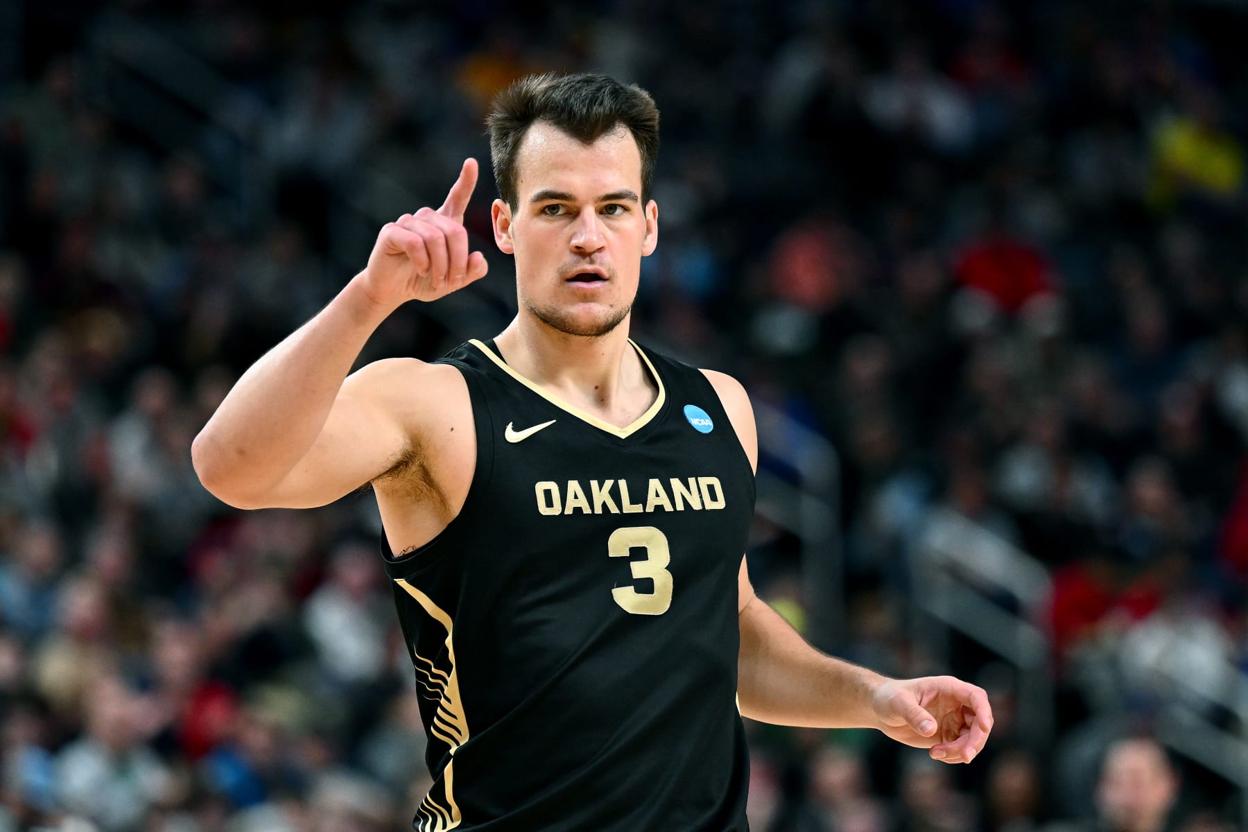 PITTSBURGH, PENNSYLVANIA - MARCH 23: Jack Gohlke #3 of the Oakland Golden Grizzlies reacts during the first half of a game against the North Carolina State Wolfpack in the second round of the NCAA Men's Basketball Tournament at PPG PAINTS Arena on March 23, 2024 in Pittsburgh, Pennsylvania. (Photo by Joe Sargent/Getty Images)