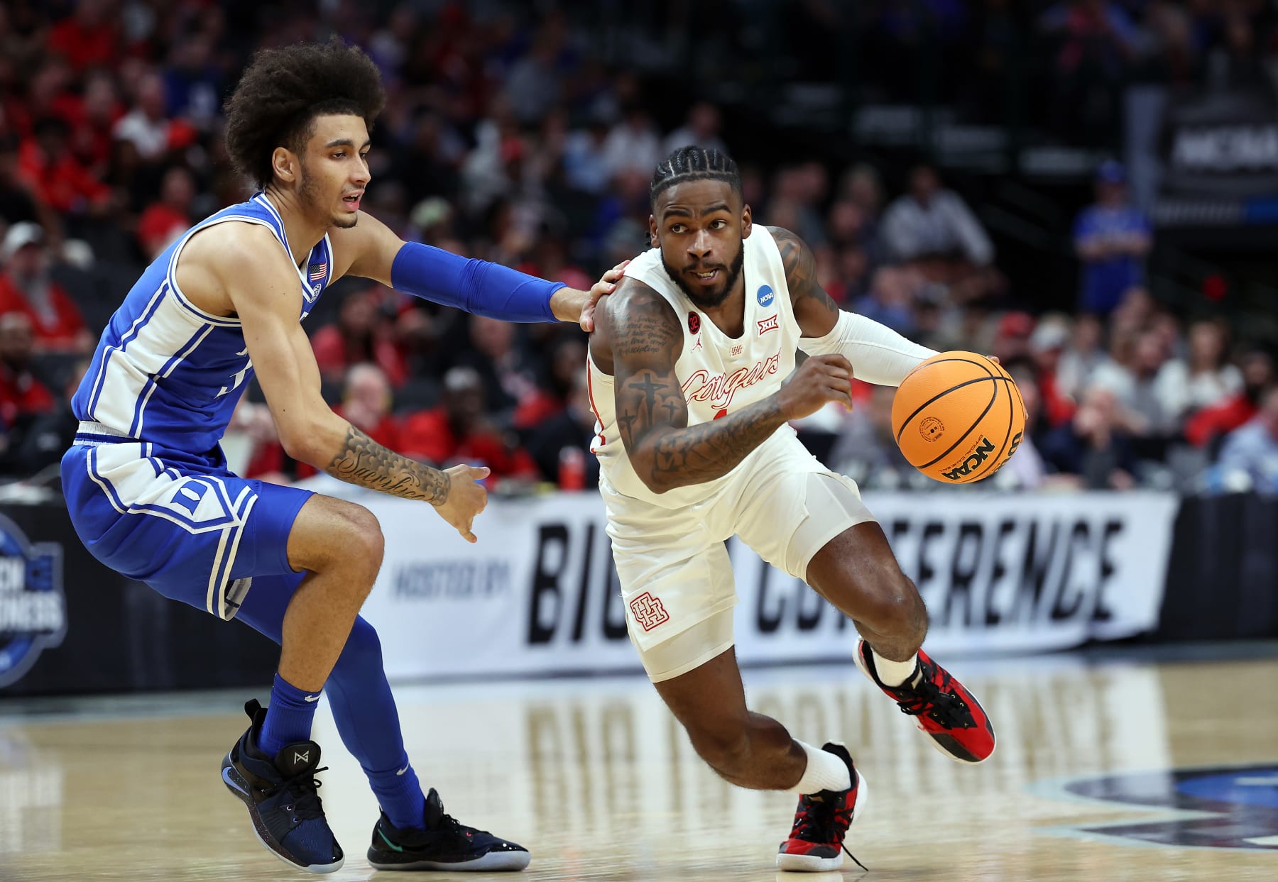 DALLAS, TEXAS - MARCH 29: Jamal Shead #1 of the Houston Cougars drives to the basket as Tyrese Proctor #5 of the Duke Blue Devils defends during the 1st half of the Sweet 16 round of the NCAA Men's Basketball Tournament at American Airlines Center on March 29, 2024 in Dallas, Texas. (Photo by Patrick Smith/Getty Images)