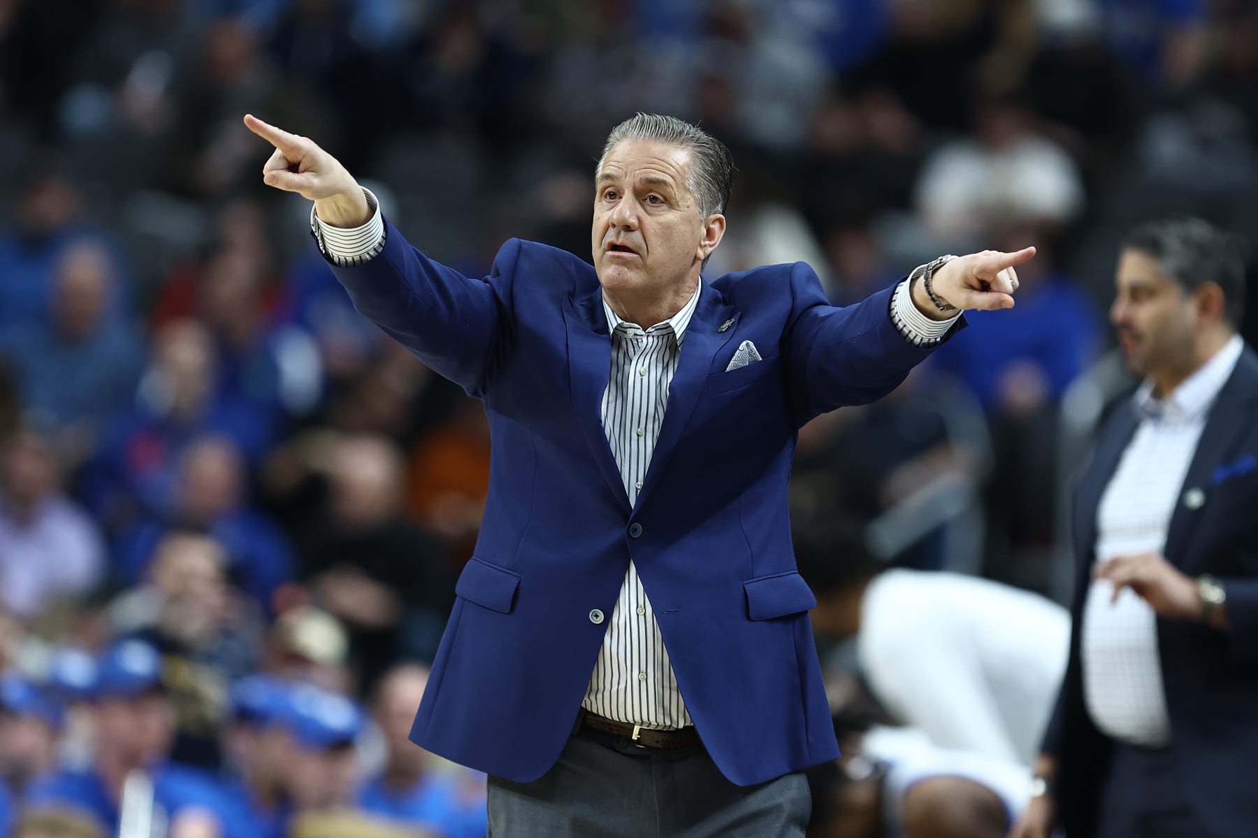 PITTSBURGH, PENNSYLVANIA - MARCH 21: Head coach John Calipari of the Kentucky Wildcats reacts during the first half of a game against the Oakland Golden Grizzlies in the first round of the NCAA Men's Basketball Tournament at PPG PAINTS Arena on March 21, 2024 in Pittsburgh, Pennsylvania. (Photo by Tim Nwachukwu/Getty Images)