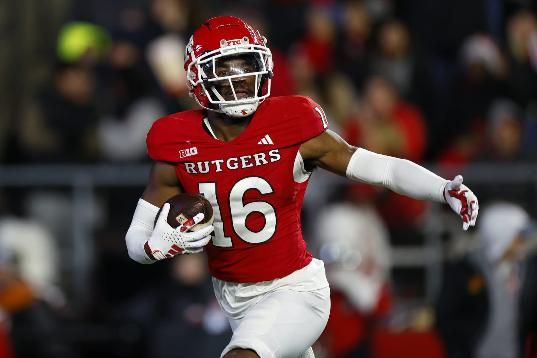 PISCATAWAY, NEW JERSEY - NOVEMBER 25: Defensive back Max Melton #16 of the Rutgers Scarlet Knights celebrates his interception against the Maryland Terrapins during the second quarter of a game at SHI Stadium on November 25, 2023 in Piscataway, New Jersey. (Photo by Rich Schultz/Getty Images)