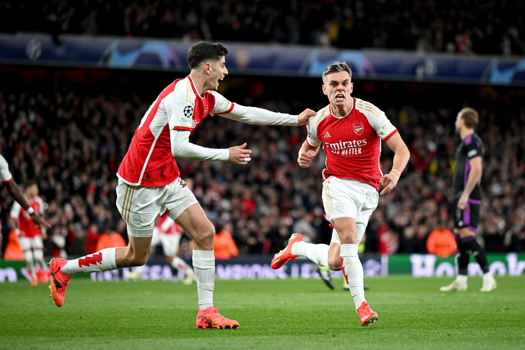 LONDON, ENGLAND - APRIL 09: Leandro Trossard of Arsenal celebrates with teammate Kai Havertz after scoring his team's second goal during the UEFA Champions League quarter-final first leg match between Arsenal FC and FC Bayern München at Emirates Stadium on April 09, 2024 in London, England. (Photo by Shaun Botterill/Getty Images)