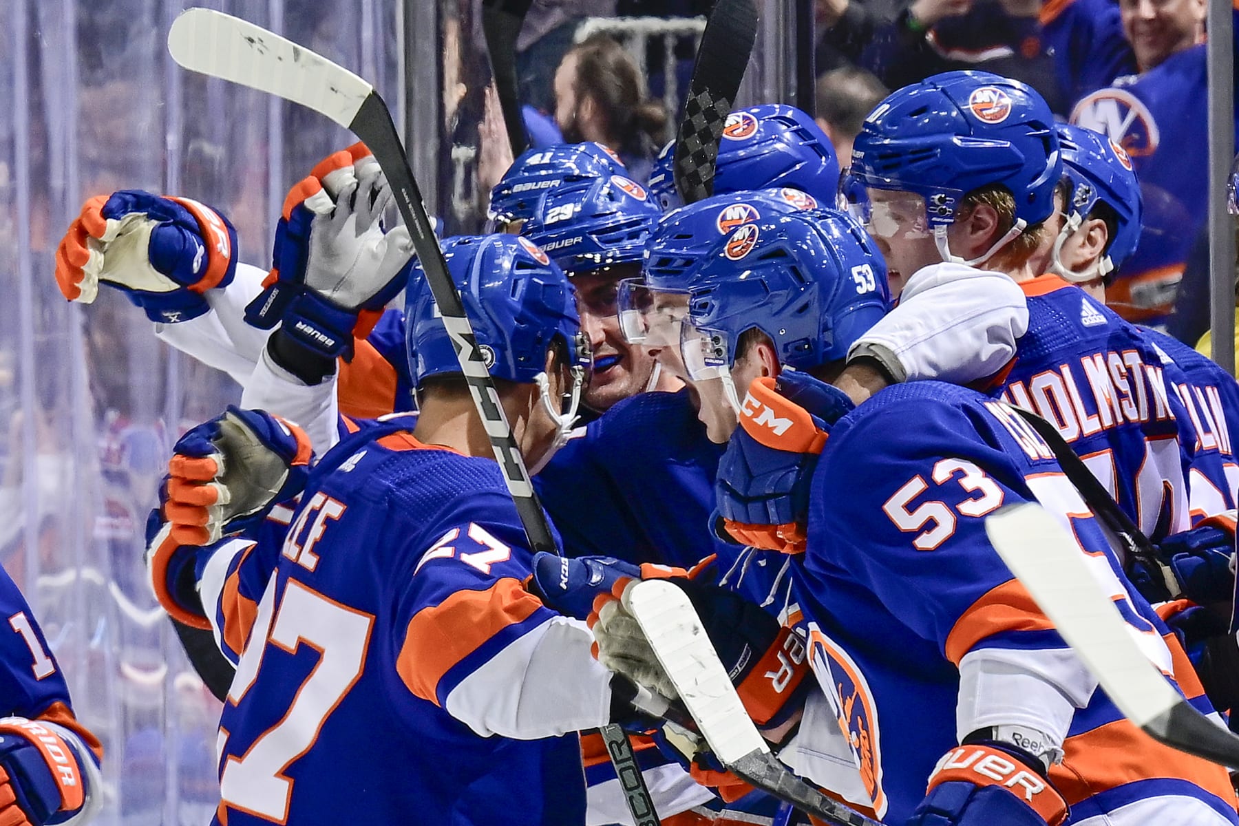 ELMONT, NEW YORK - APRIL 09: Anders Lee #27 of the New York Islanders is congratulated by his teammates after scoring an empty-net goal against the New York Rangers during the third period at UBS Arena on April 09, 2024 in Elmont, New York. (Photo by Steven Ryan/NHLI via Getty Images)