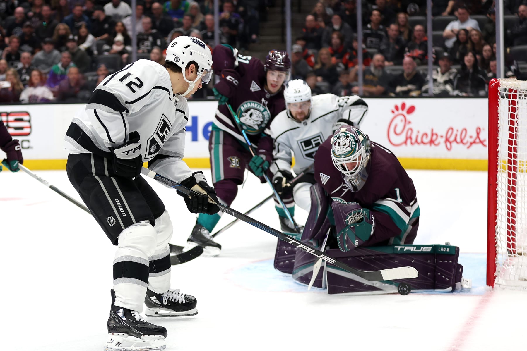 ANAHEIM, CALIFORNIA - APRIL 09: Lukas Dostal #1 of the Anaheim Ducks blocks a shot on goal by Trevor Moore #12 of the Los Angeles Kings during the third period of a game at Honda Center on April 09, 2024 in Anaheim, California. (Photo by Sean M. Haffey/Getty Images)
