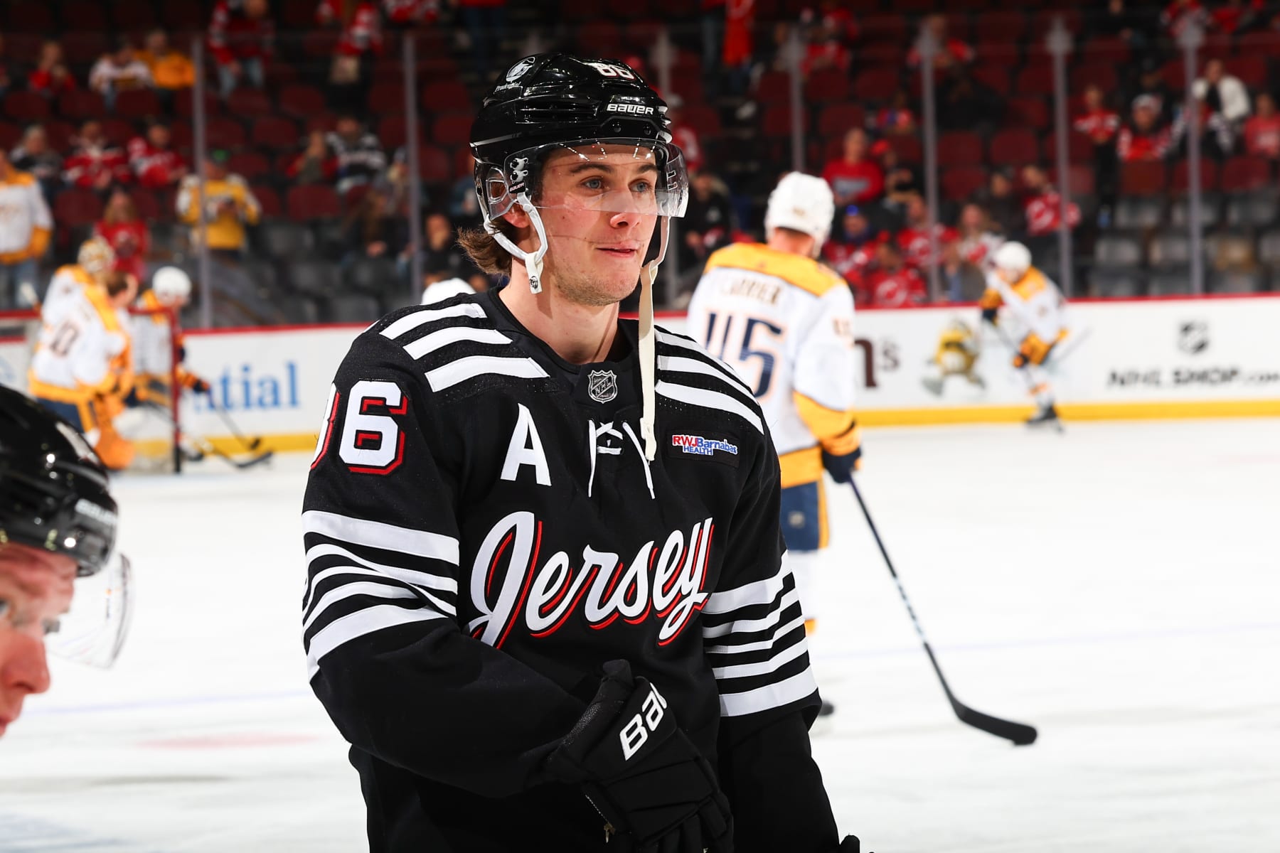NEWARK, NJ - APRIL 07: Jack Hughes #86 of the New Jersey Devils skates during warm up prior to the game against the Nashville Predators at the Prudential Center on April 7, 2024 in Newark, New Jersey. (Photo by Rich Graessle/NHLI via Getty Images)