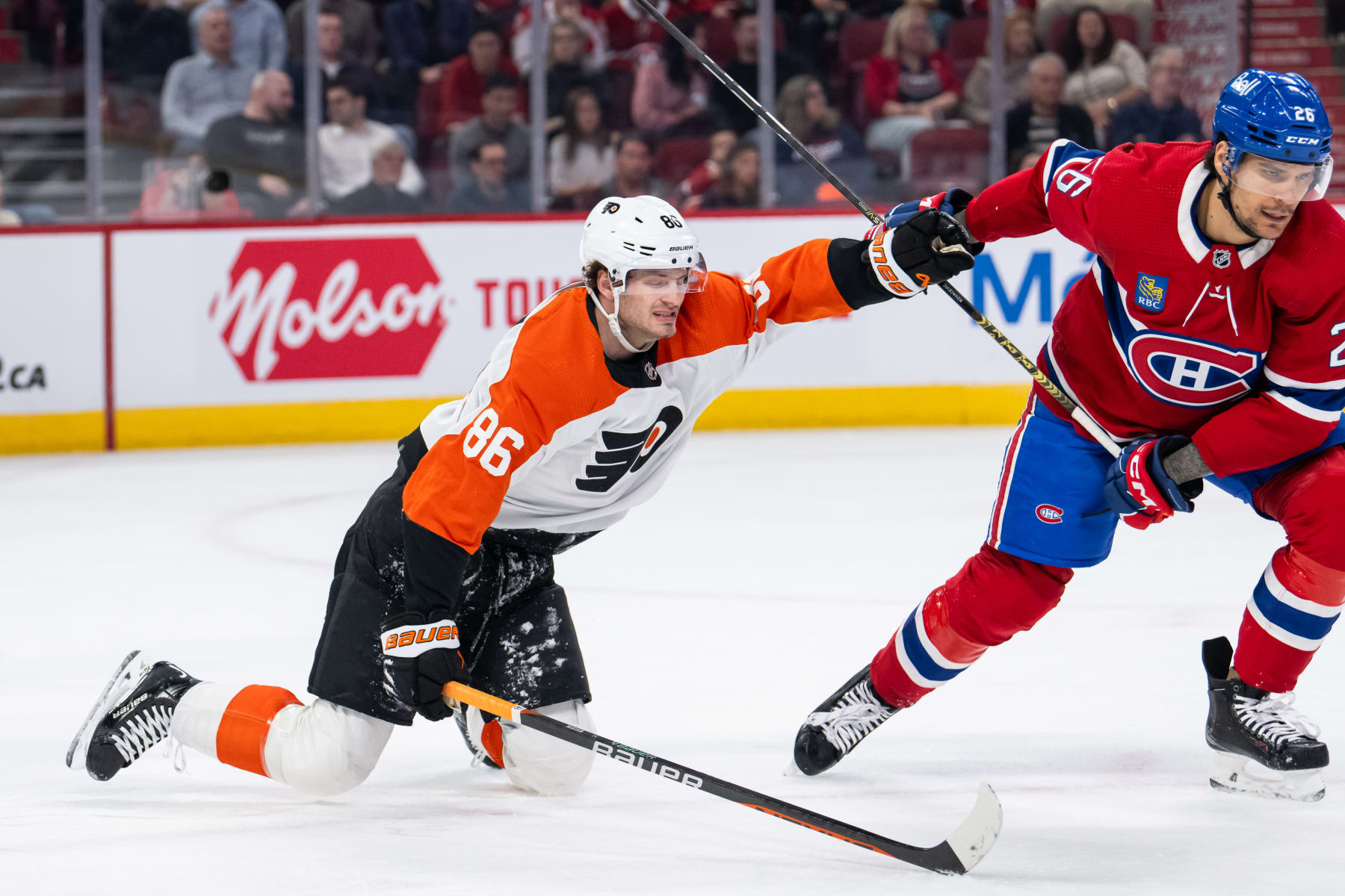 MONTREAL, QC - APRIL 09: Joel Farabee (86) of the Philadelphia Flyers grabs Johnathan Kovacevic (26) of the Montreal Canadiens while falling during the first period of the NHL game between the Philadelphia Flyers and the Montreal Canadiens on April 9, 2024, at the Bell Centre in Montreal, QC (Photo by Vincent Ethier/Icon Sportswire via Getty Images)