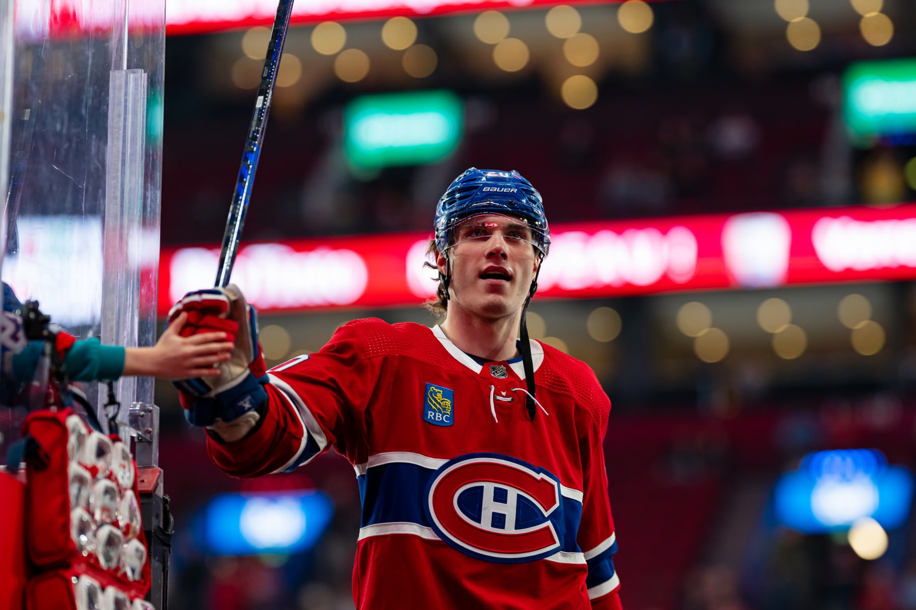 MONTREAL, CANADA - APRIL 9: Juraj Slafkovsky #20 of the Montreal Canadiens fist-bumps a fan during the warm-up of NHL regular season game between the Montreal Canadiens and the Philadelphia Flyers at the Bell Centre on April 9, 2024 in Montreal, Quebec, Canada. (Photo by Matt Garies/NHLI via Getty Images)